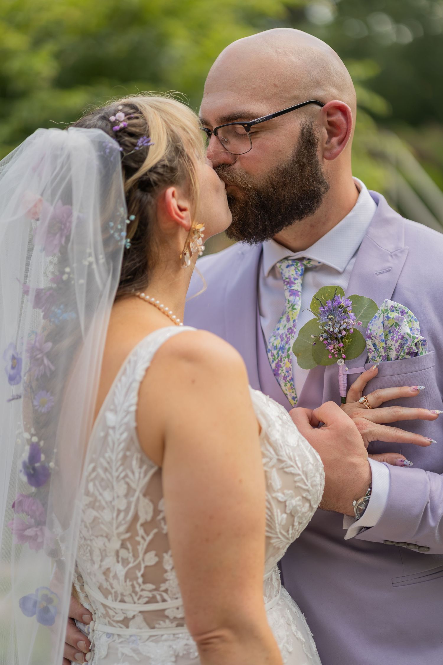 Bride and groom sharing joyful moments on their wedding day with timeless portraits, candid emotions, and elegant details.