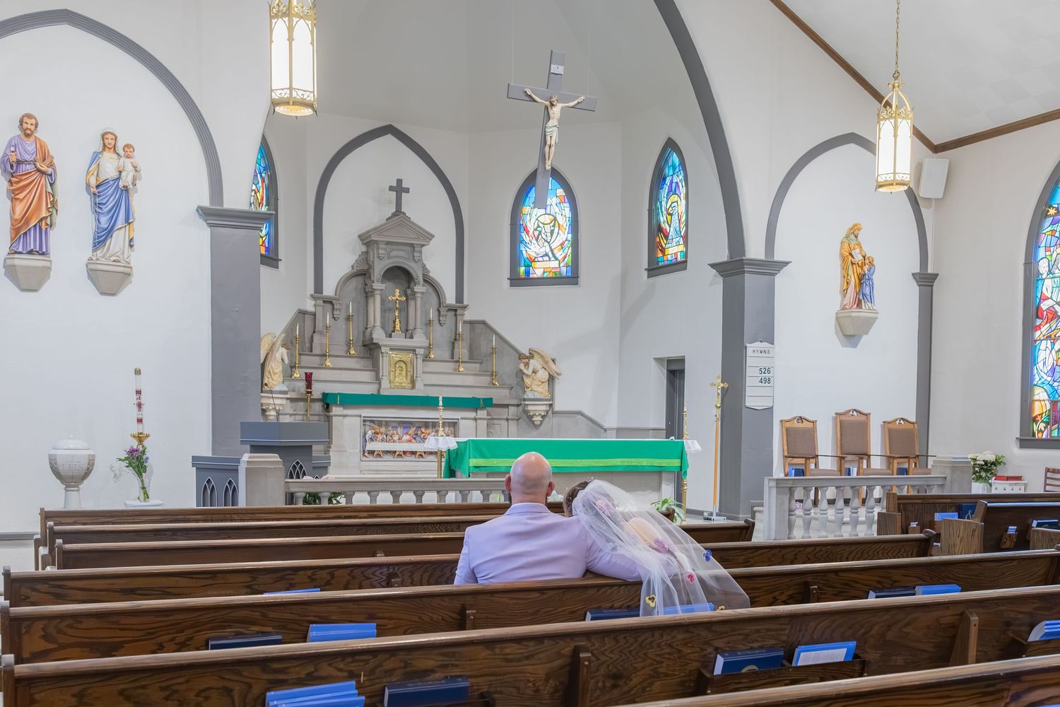 Bride and groom sharing joyful moments on their wedding day with timeless portraits, candid emotions, and elegant details.