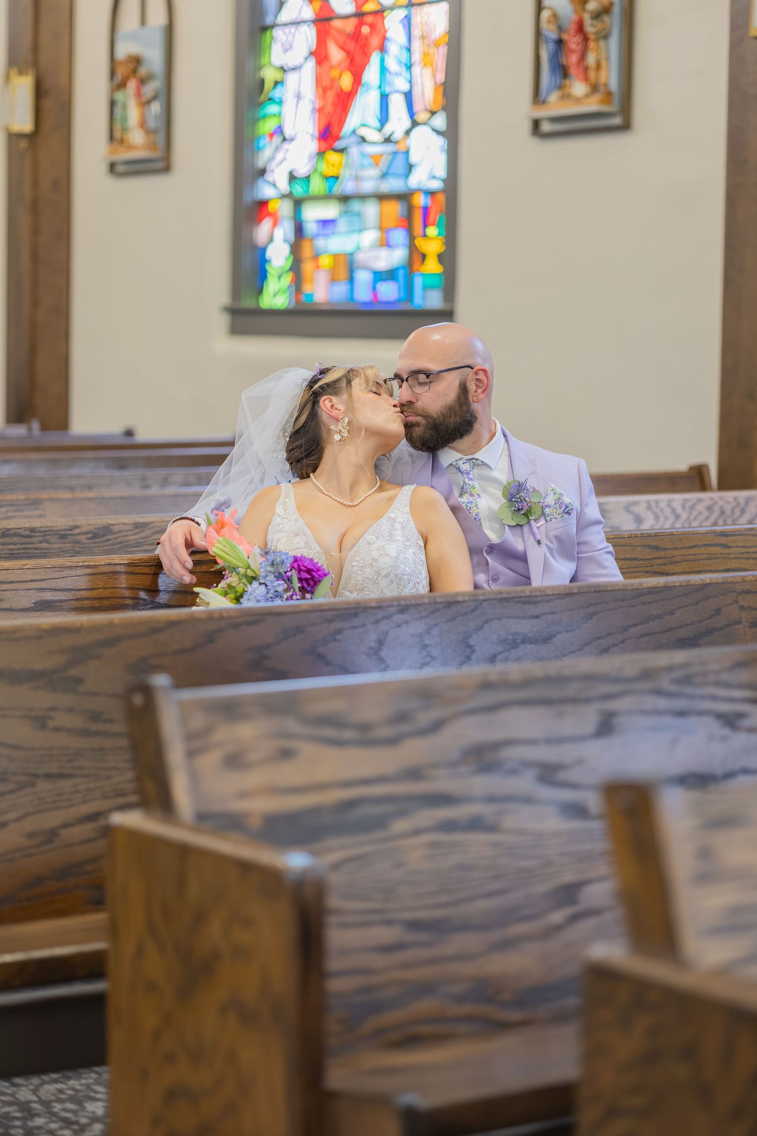 Bride and groom sharing joyful moments on their wedding day with timeless portraits, candid emotions, and elegant details.