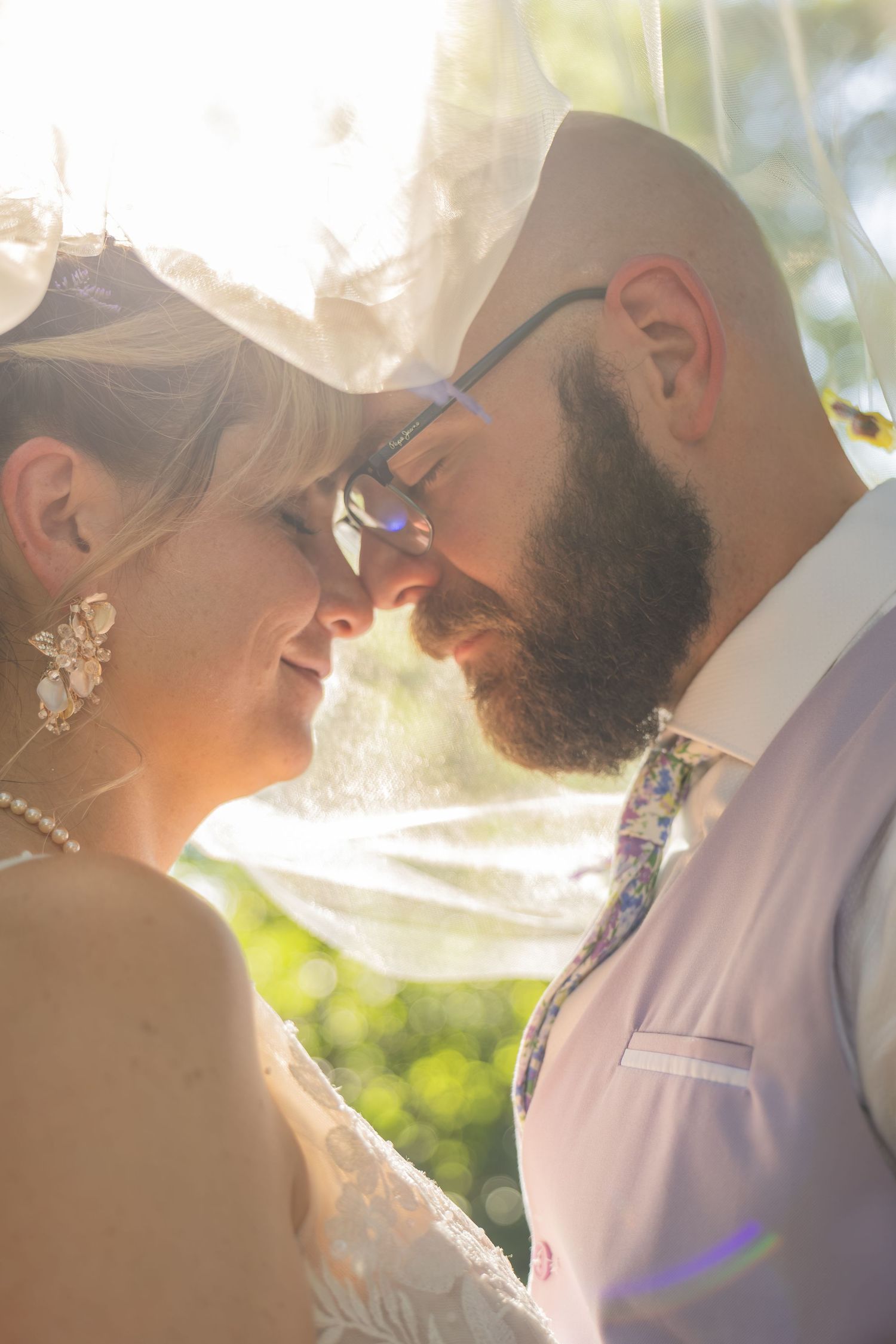 Bride and groom sharing joyful moments on their wedding day with timeless portraits, candid emotions, and elegant details.