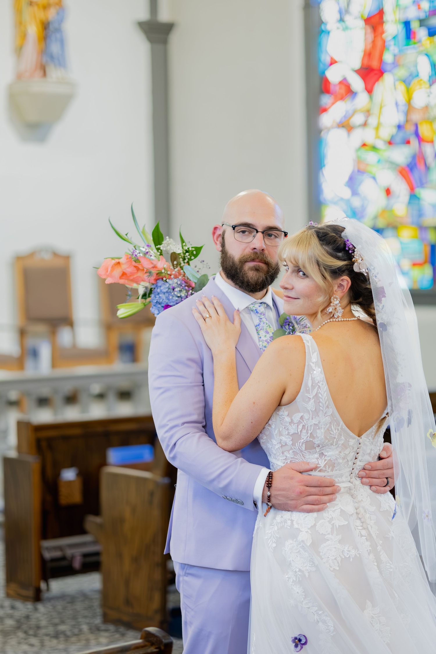 Bride and groom sharing joyful moments on their wedding day with timeless portraits, candid emotions, and elegant details.