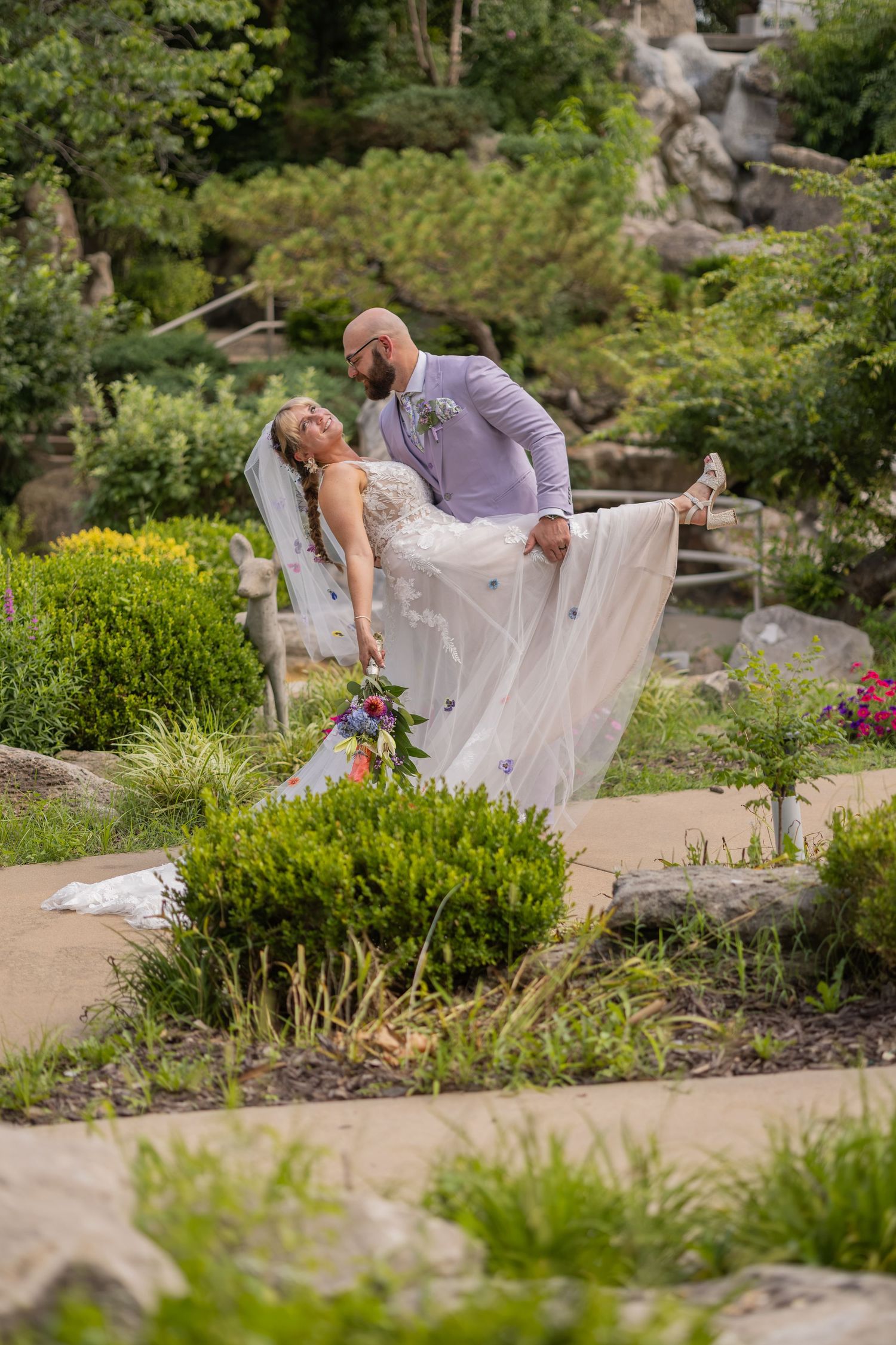 Bride and groom sharing joyful moments on their wedding day with timeless portraits, candid emotions, and elegant details.