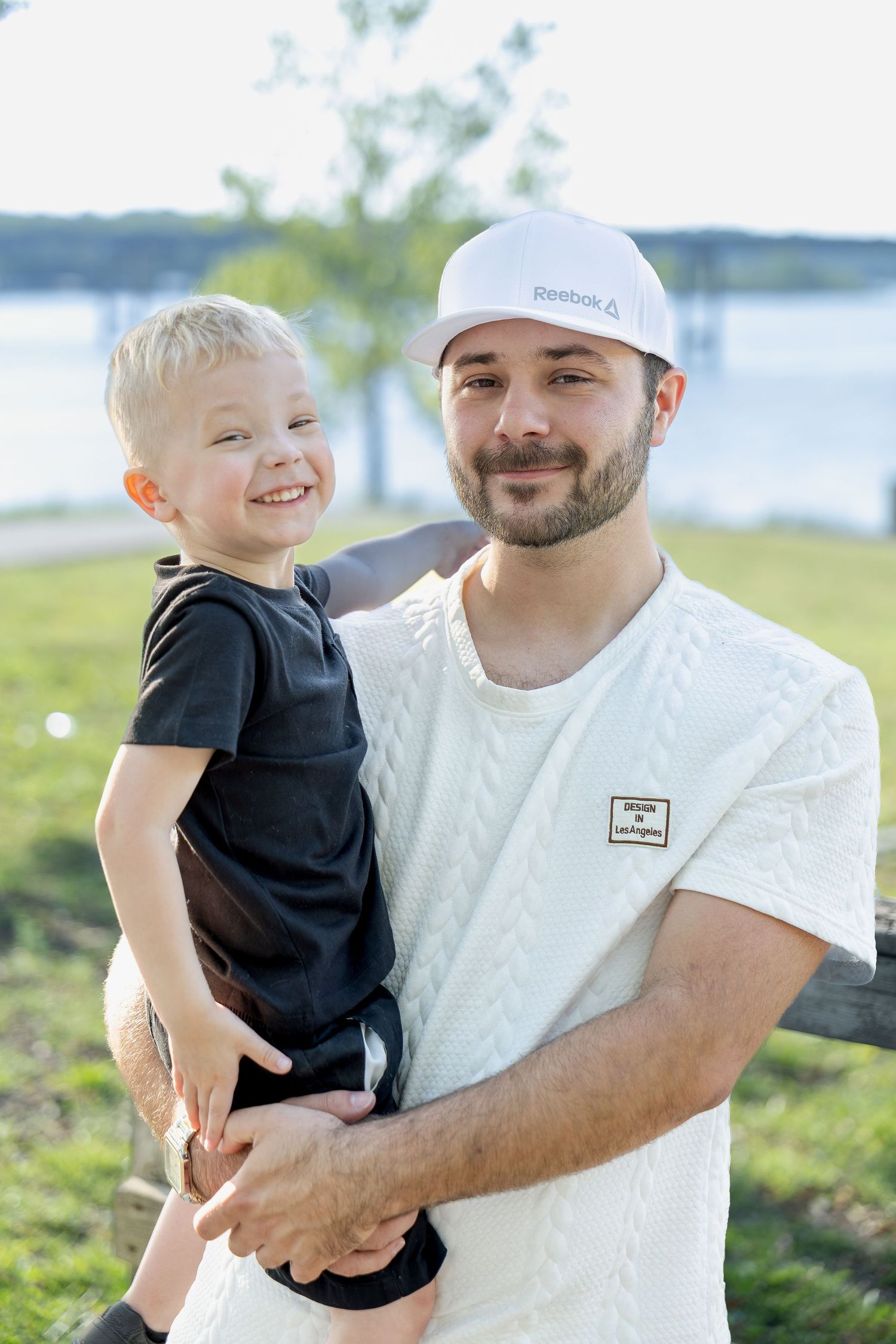 Family portrait session capturing genuine smiles, natural interactions, and timeless memories in a beautiful outdoor setting.