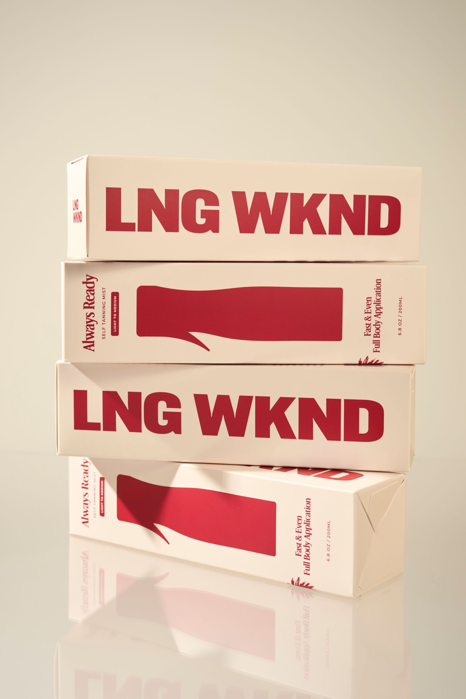 Two stacked LNG WKND branded white and red product boxes labeled Always Ready on a reflective surface.