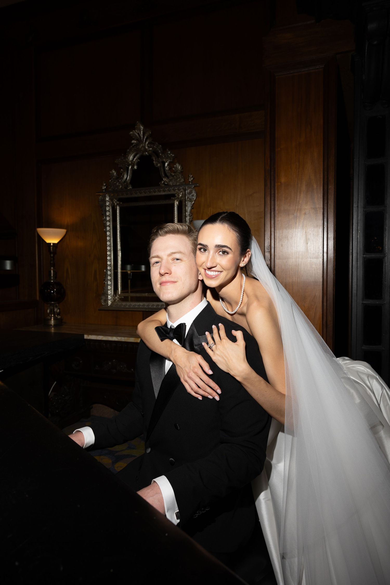 Luxury wedding photography highlighting the bride's gown and groom's tailored suit