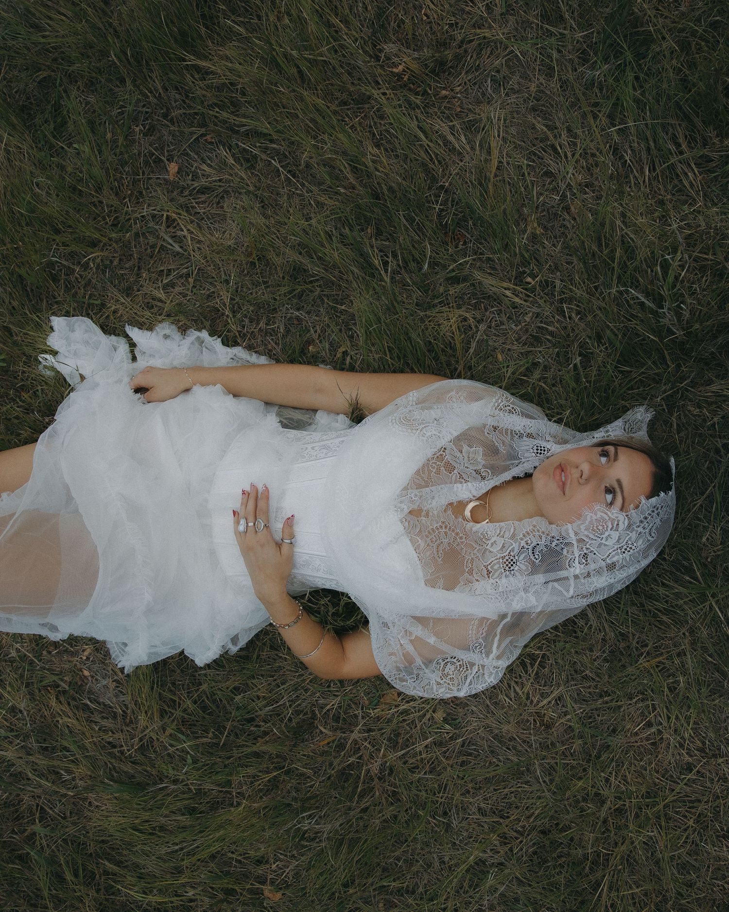 Romantic bridal getting-ready details styled with soft warm lighting