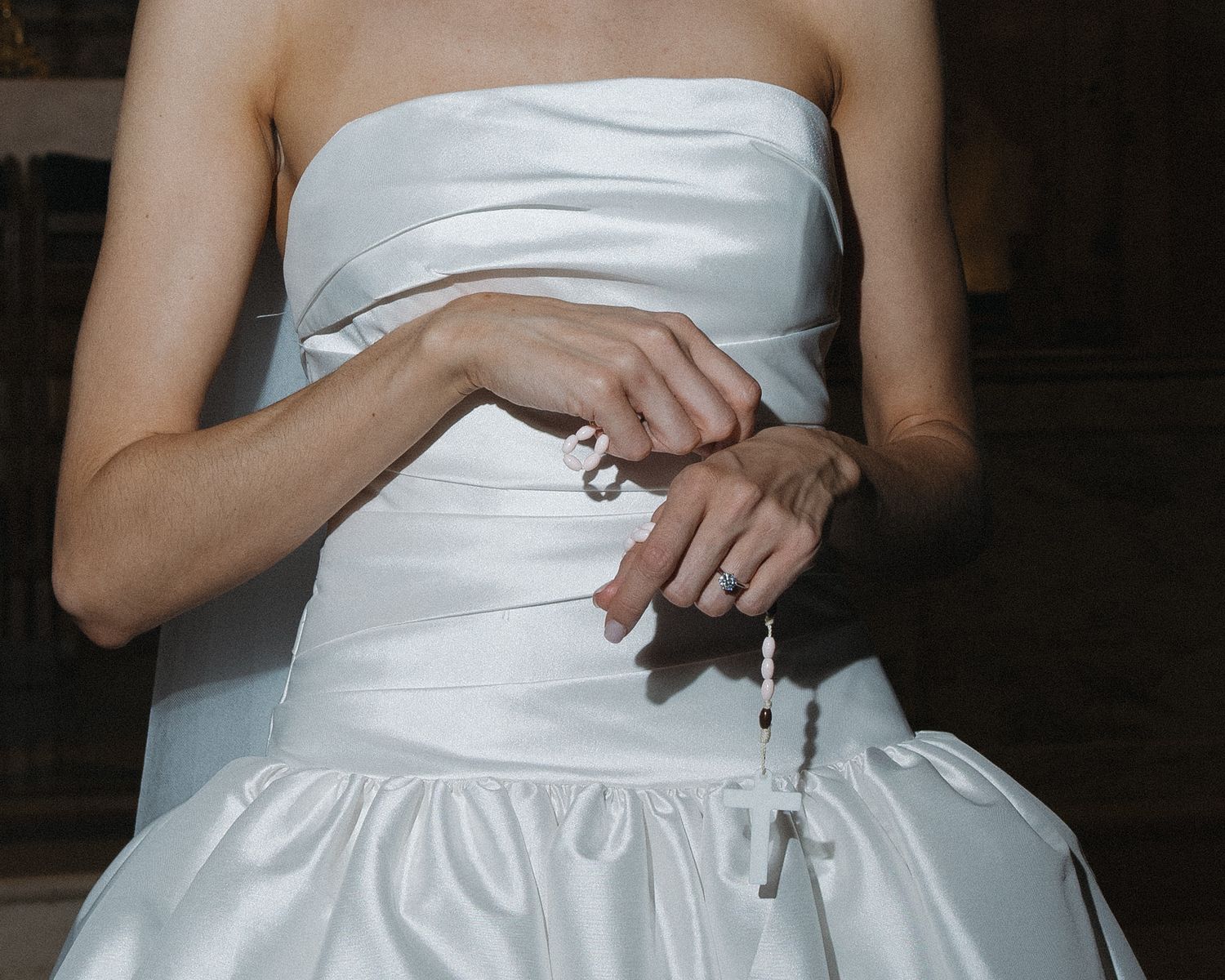 Close-up of a Catholic bride holding a rosary