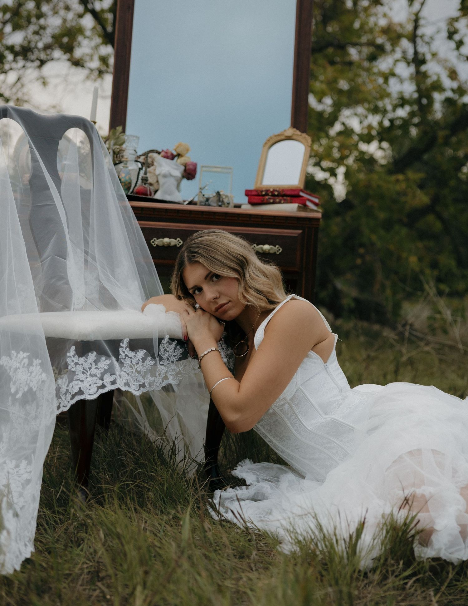 Romantic and moody bridal portrait featuring dramatic light and soft shadows