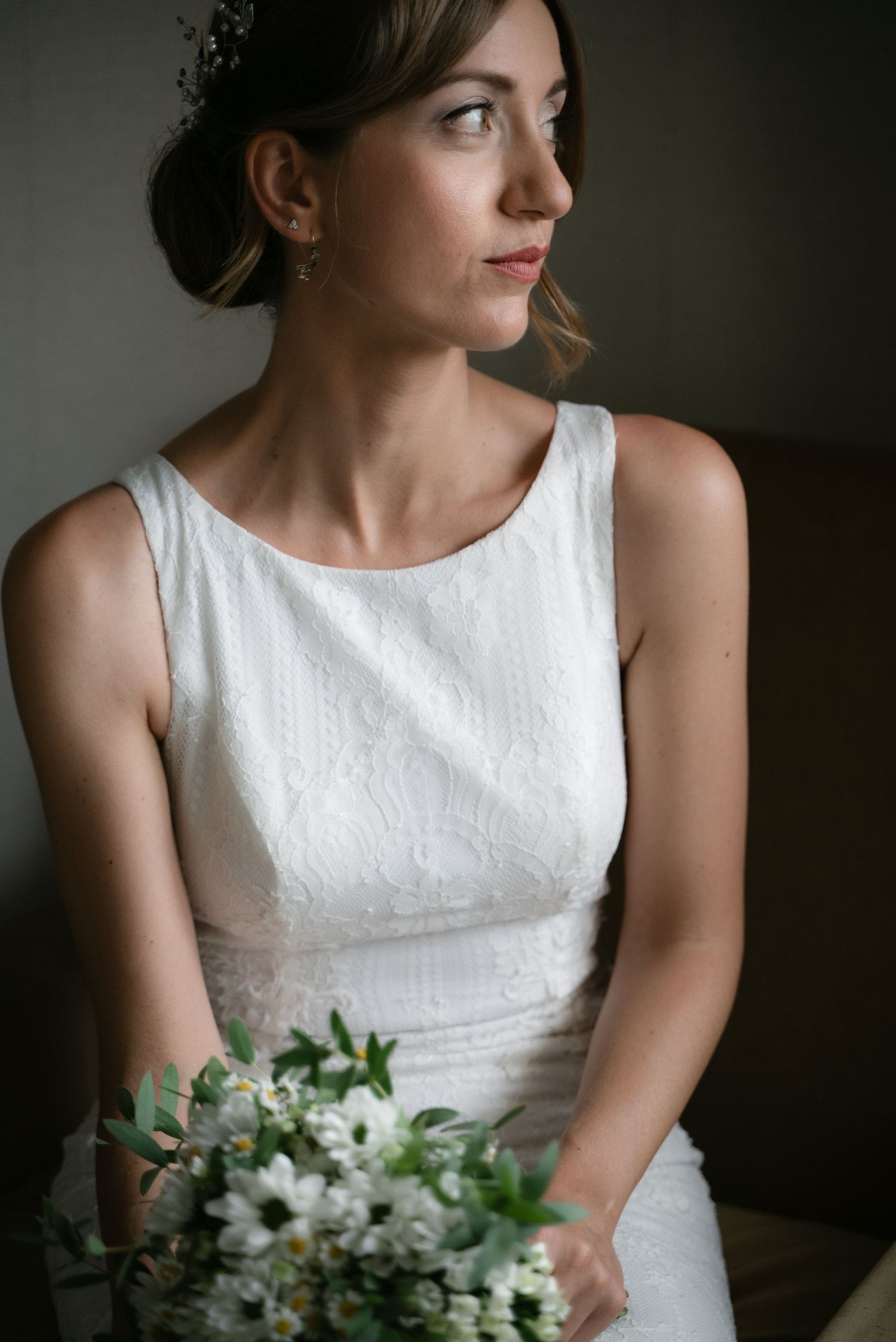Bride holding her white and green wedding bouquet