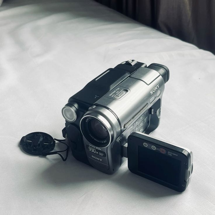 Wedding photographer filming the bride with an original vintage camcorder for a raw VHS wedding film in Italy.