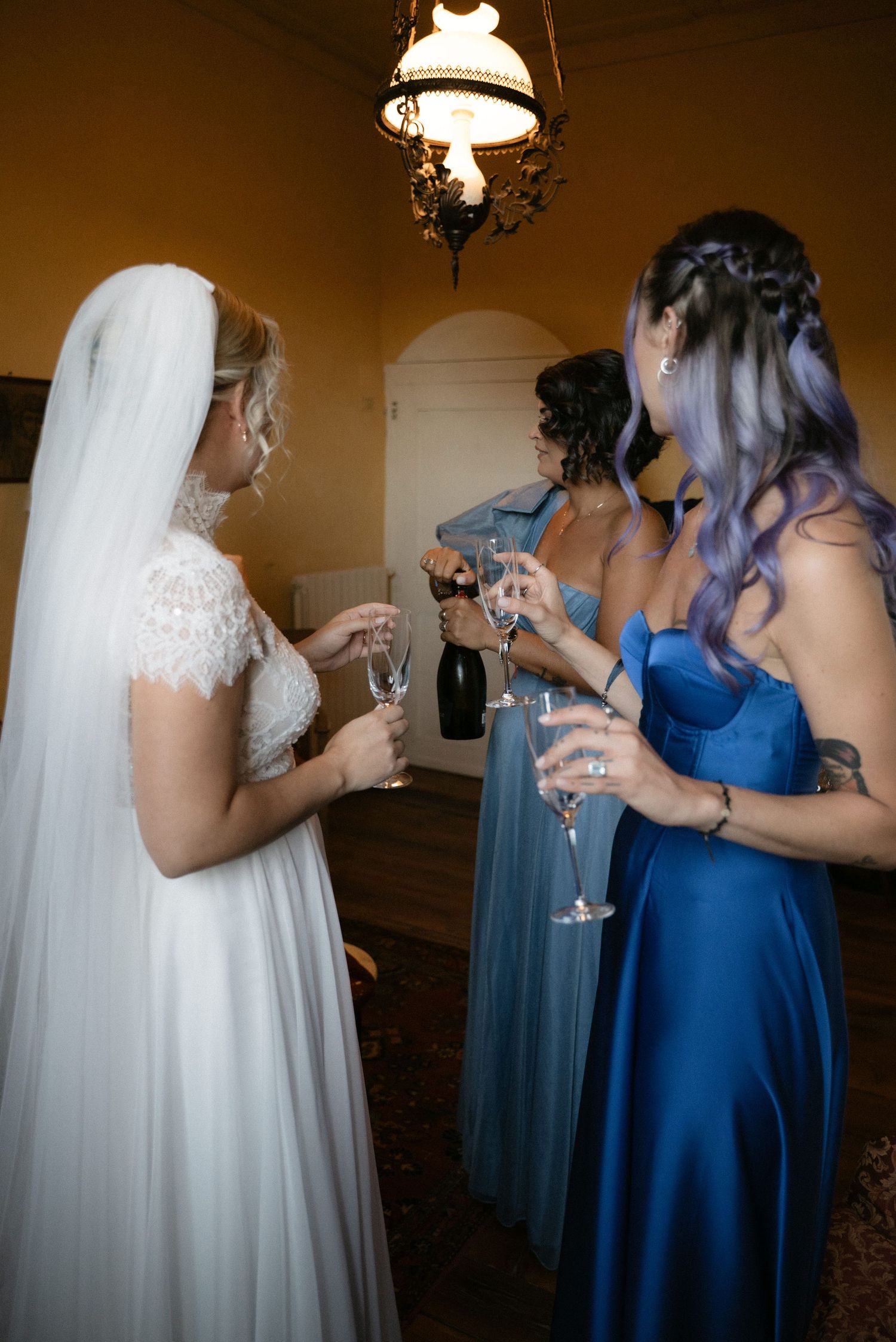 Bride sharing a drink with friends before the wedding