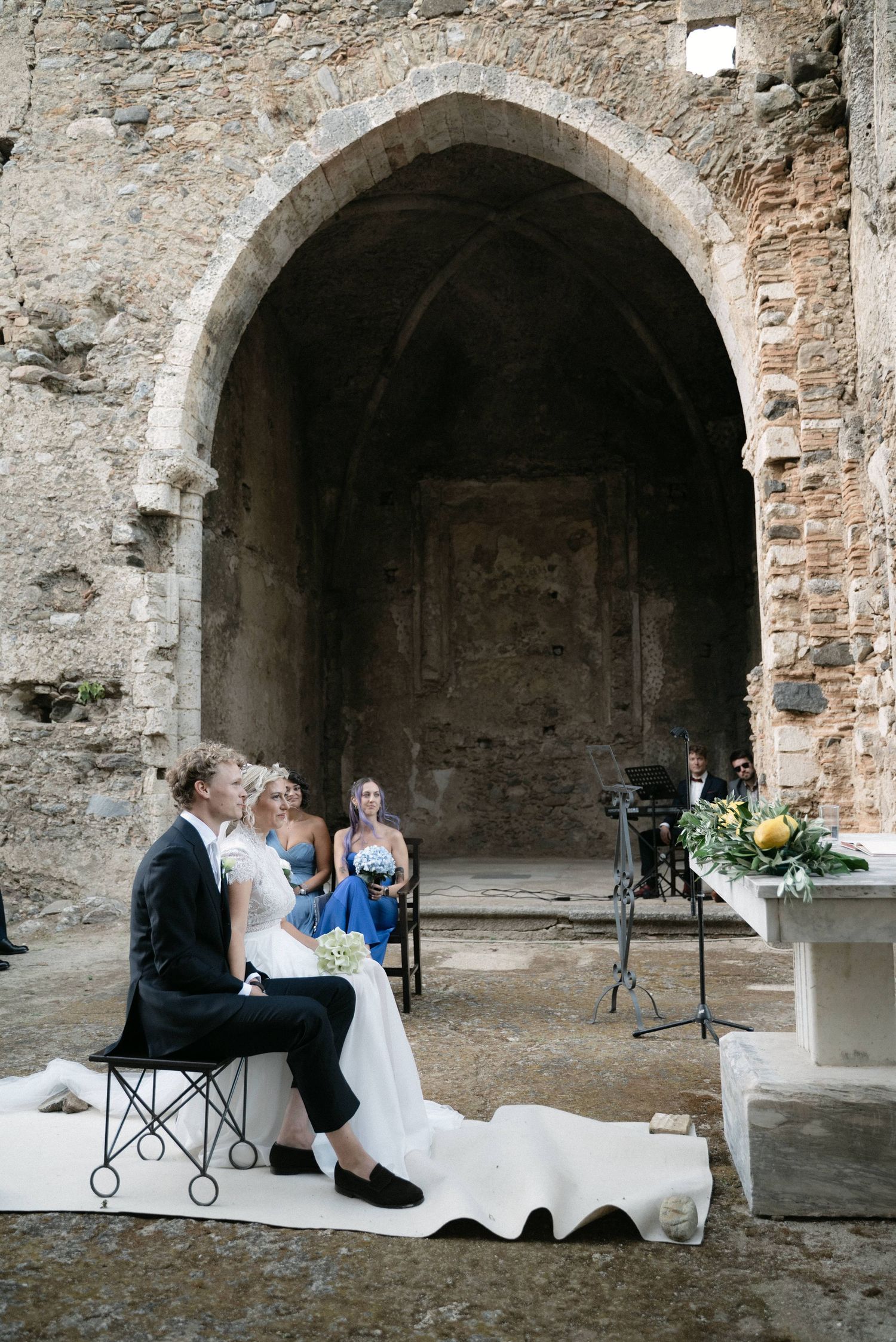 Wedding ceremony framed by the historic architecture of Borgo del Convento