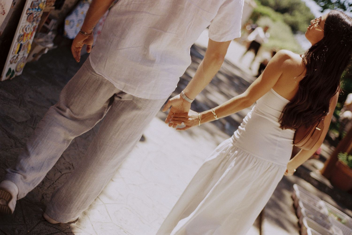 Couple walking hand in hand through the streets of Ravello