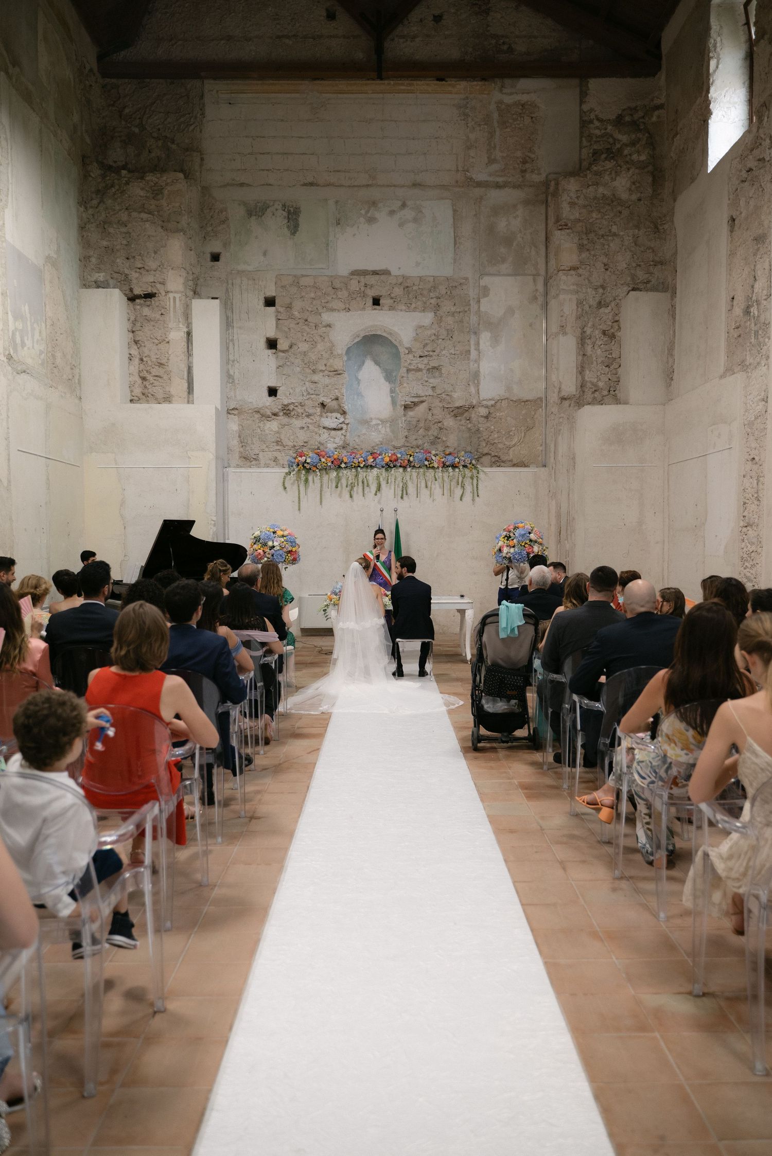 Wedding ceremony inside a historic venue in Tropea