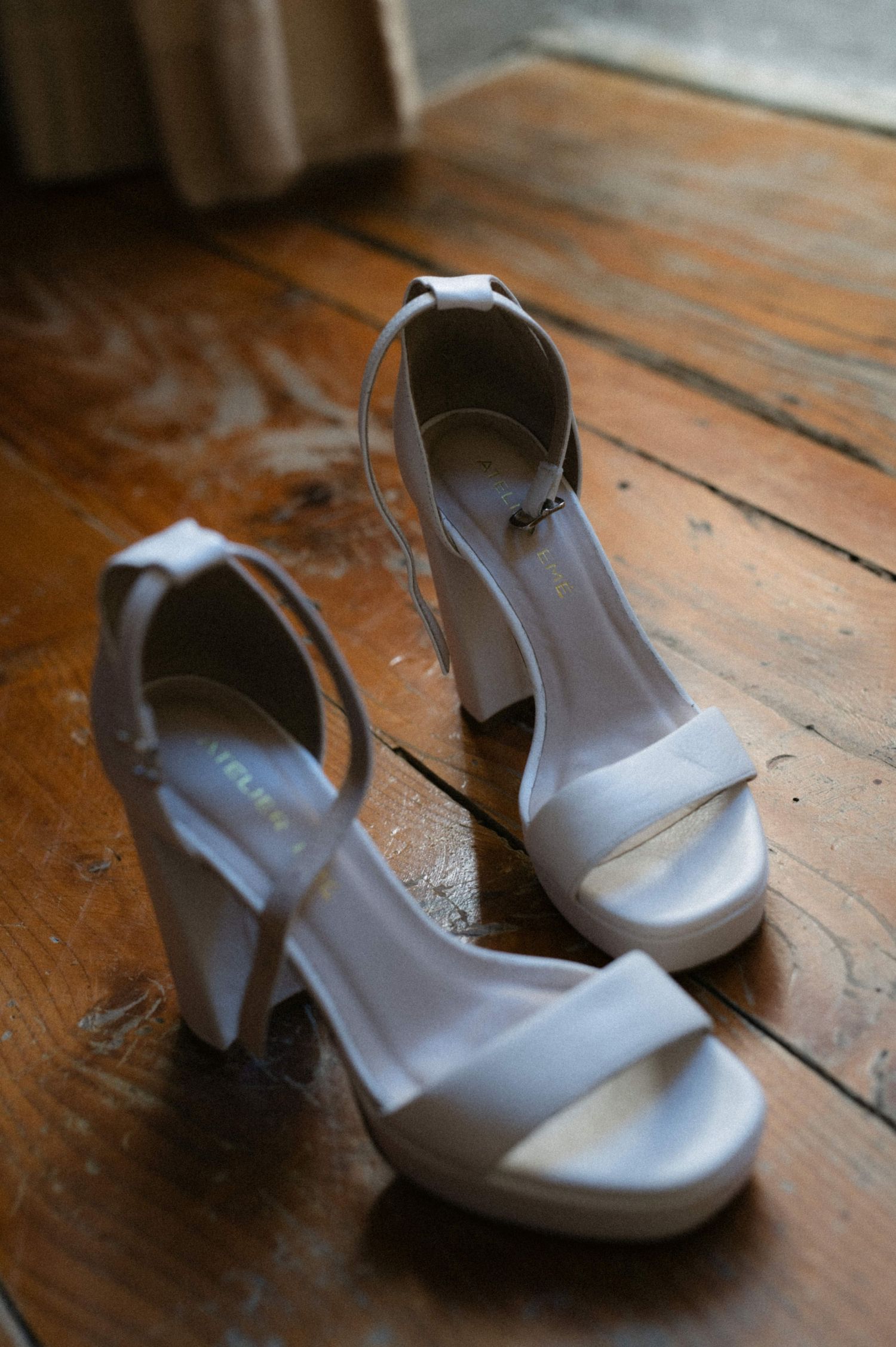 White bridal shoes on the wooden floor at Borgo del Convento