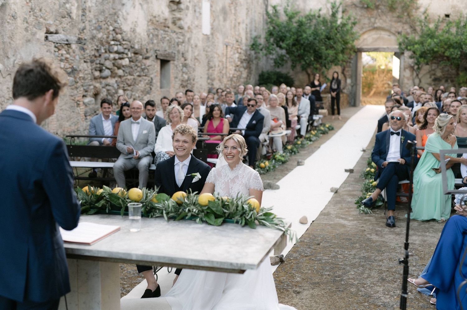 Bride and groom laughing during their wedding ceremony