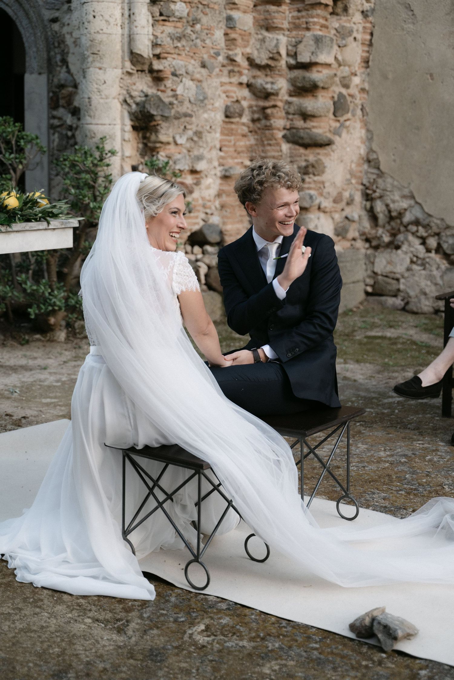 Serena and Paul exchanging a smile at the wedding altar