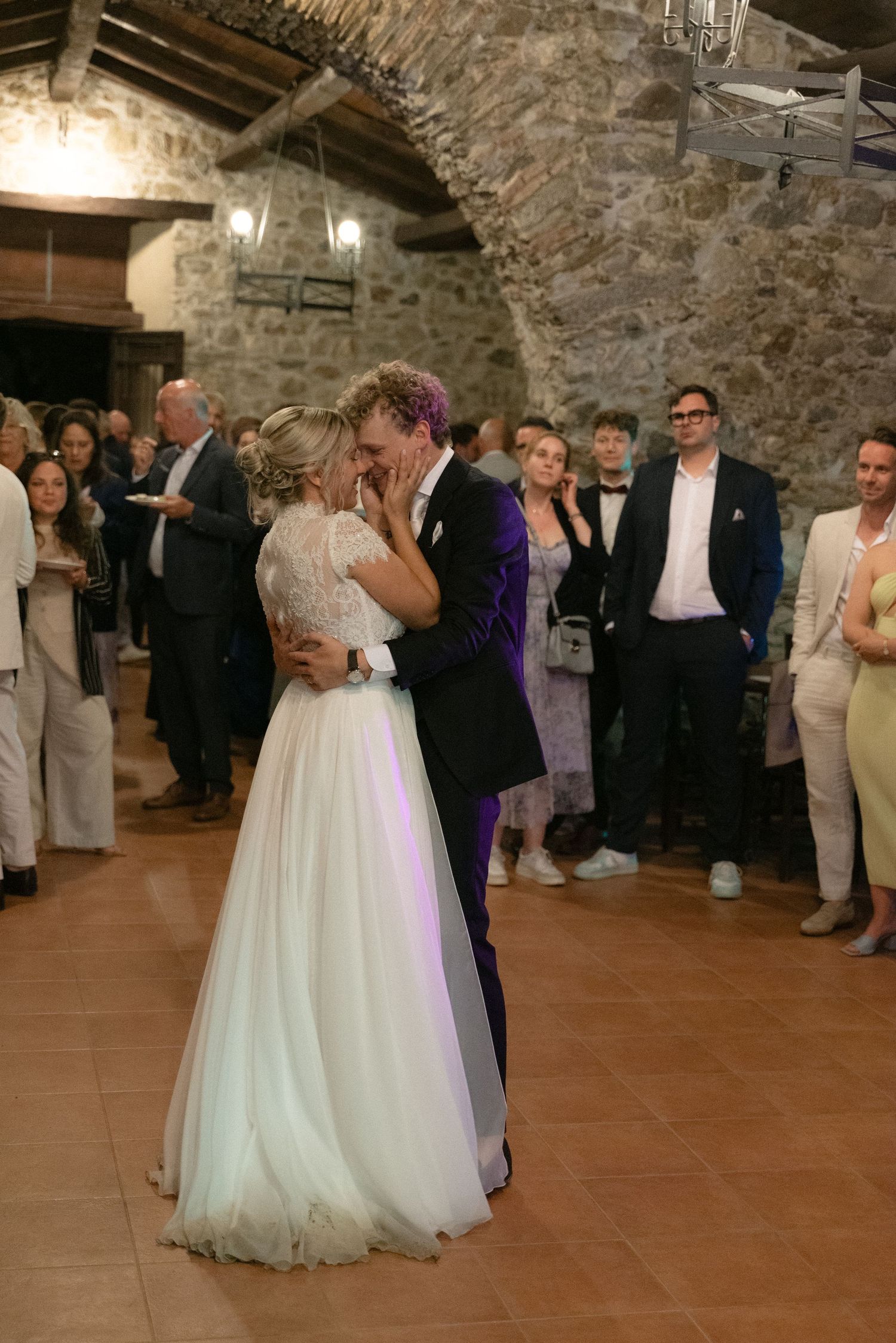 Serena and Paul kissing during their wedding reception