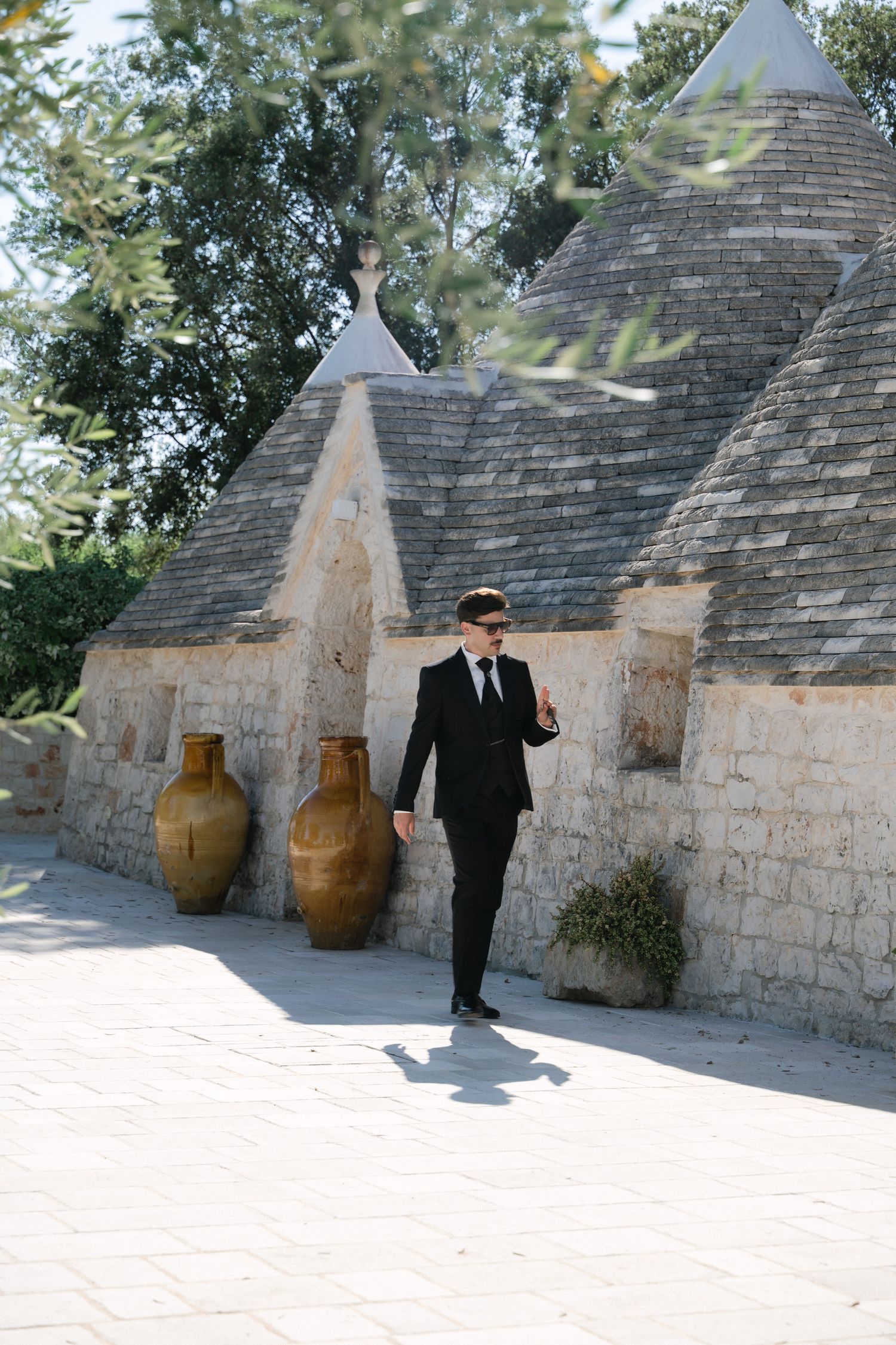 Destination wedding photography in Alberobello, Puglia, captured in digital with a clean and elegant visual style.