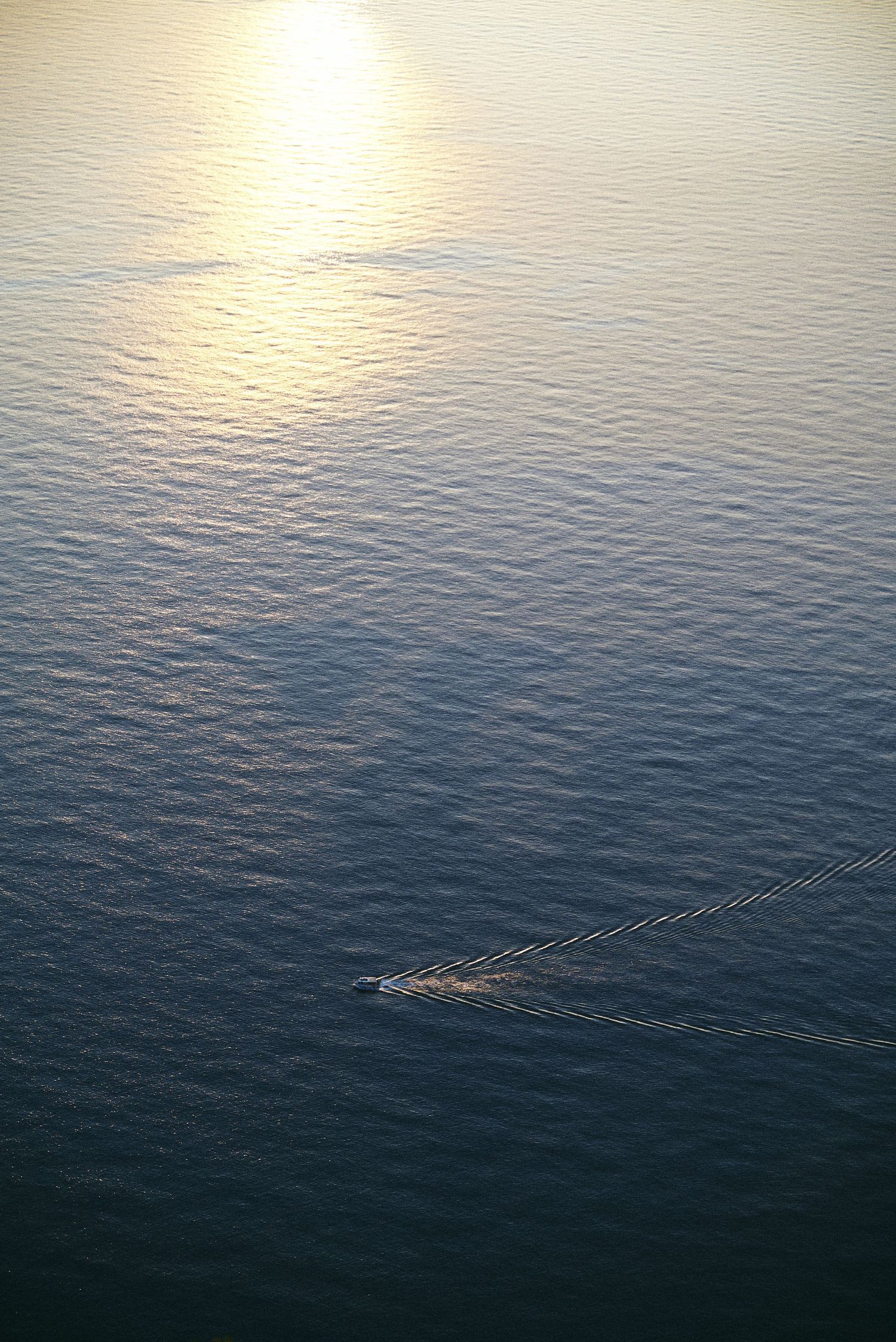 Boat crossing the Tyrrhenian Sea along the Calabrian coast