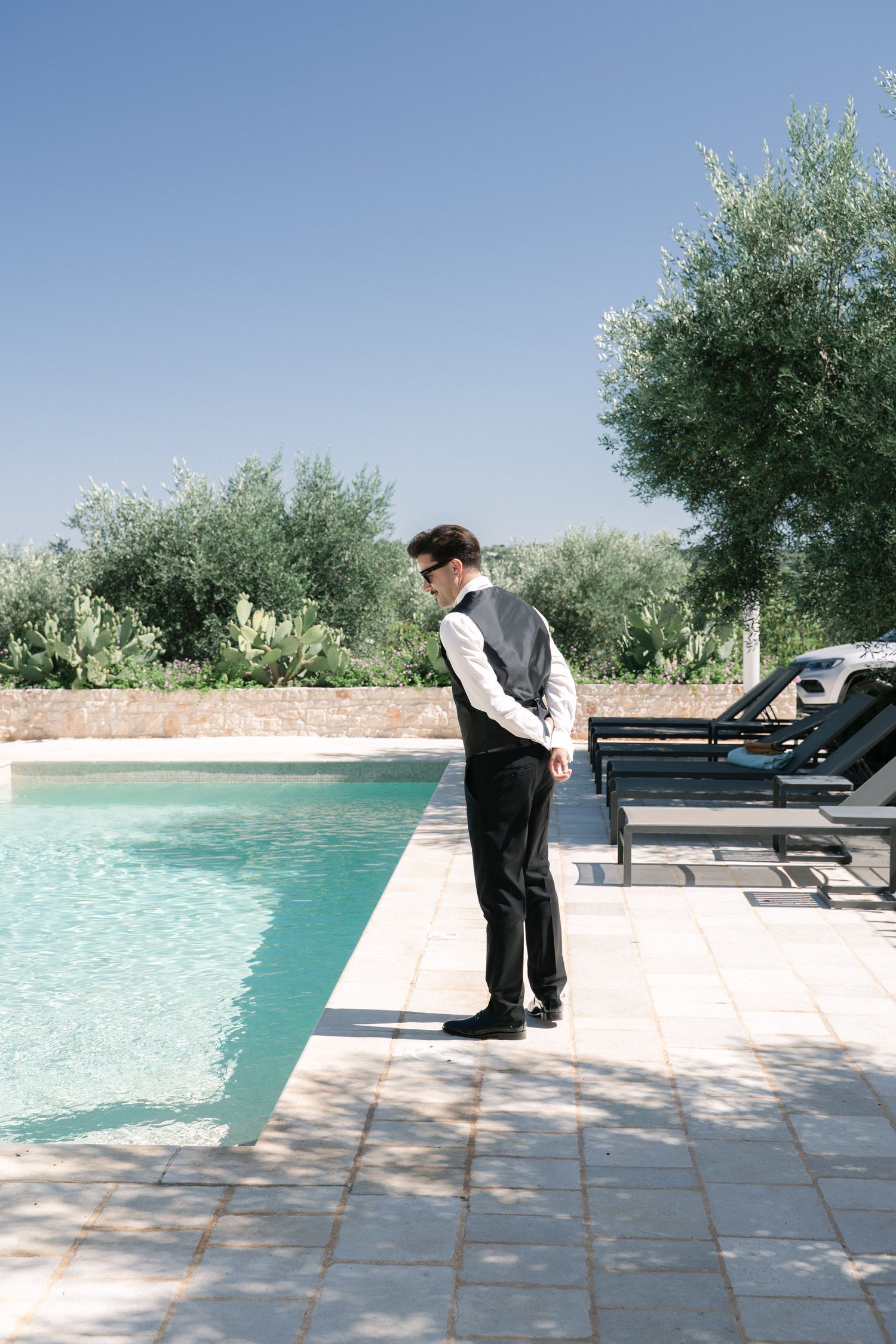 Destination wedding photography in Alberobello, Puglia, captured in digital with a clean and elegant visual style.