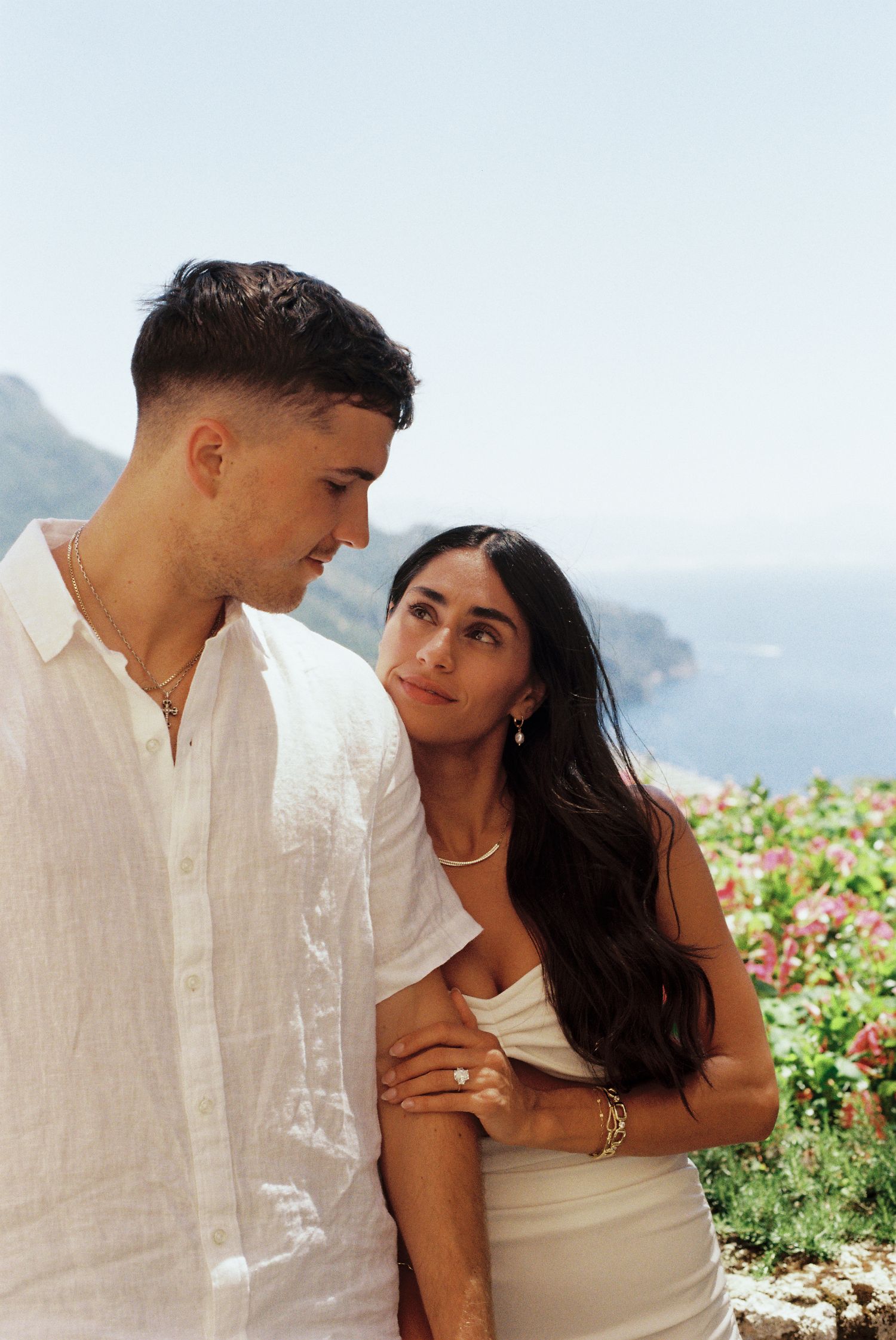 Newly engaged couple overlooking the Mediterranean Sea