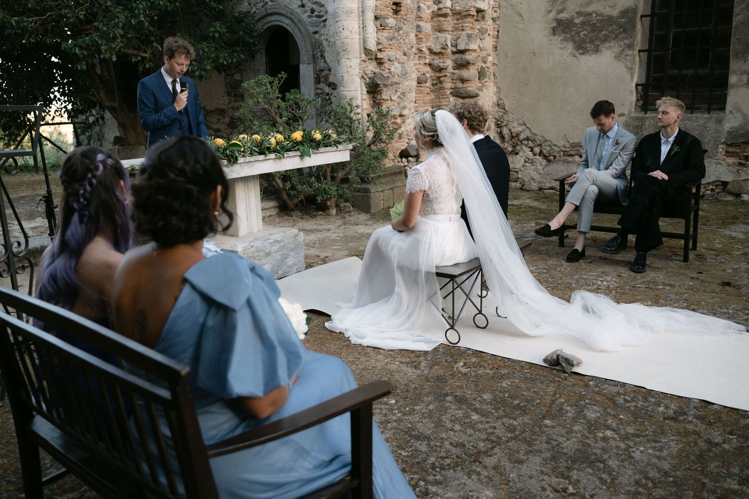 Bride and groom listening together during the ceremony