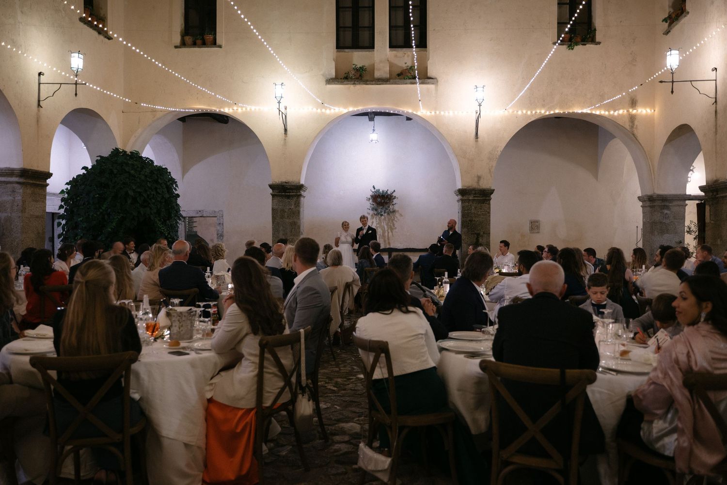 Evening wedding dinner inside the monastery courtyard