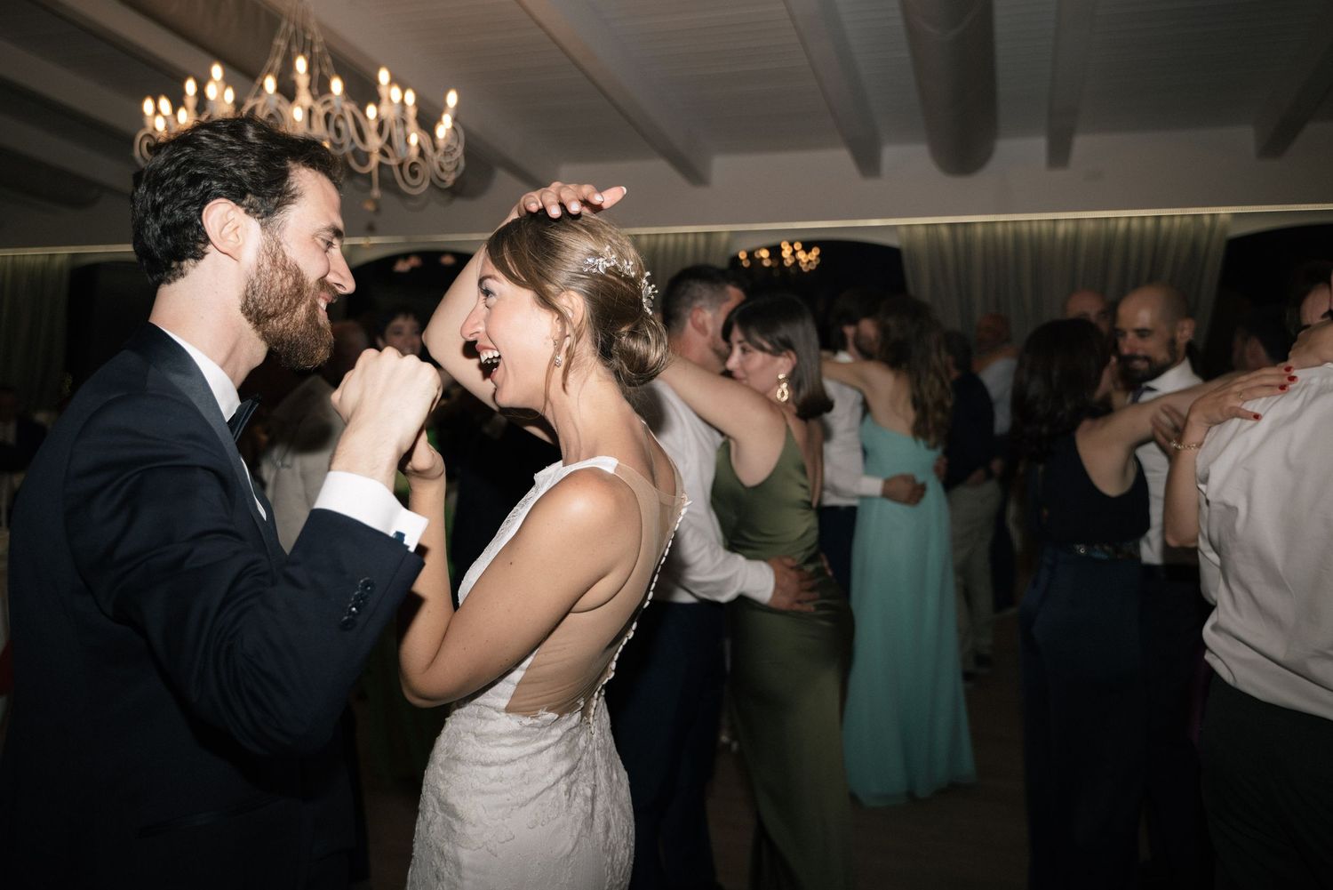Bride and groom dancing with their guests at Villa Perara