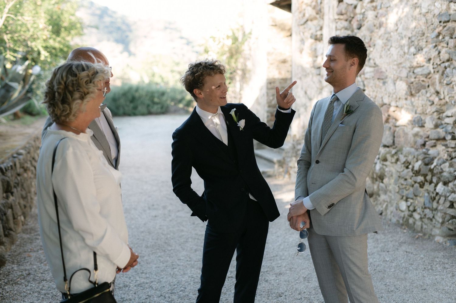 Groom talking with guests outside Borgo del Convento