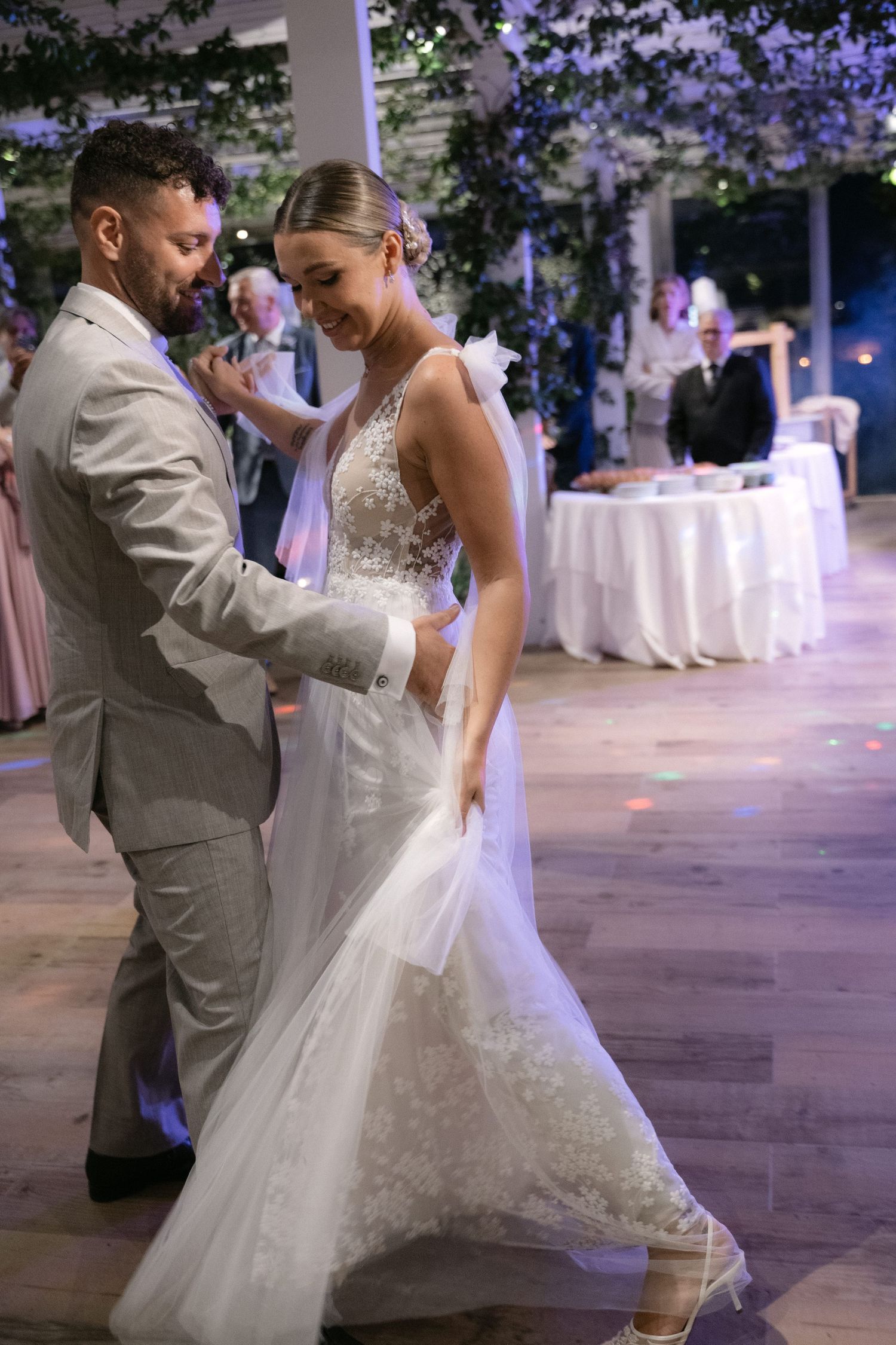 Bride and groom dancing together during their wedding reception