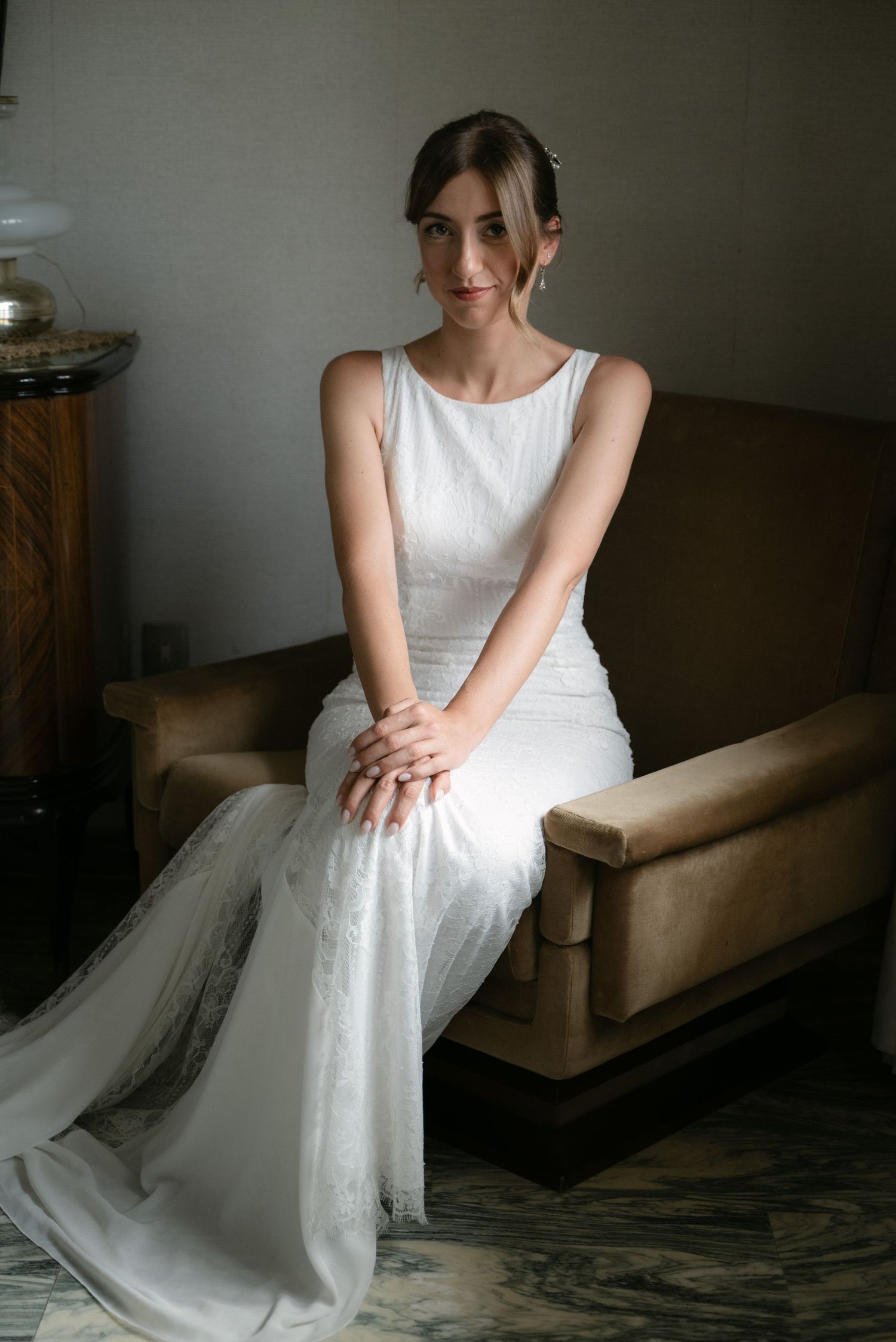 Bride seated in her wedding dress before the ceremony