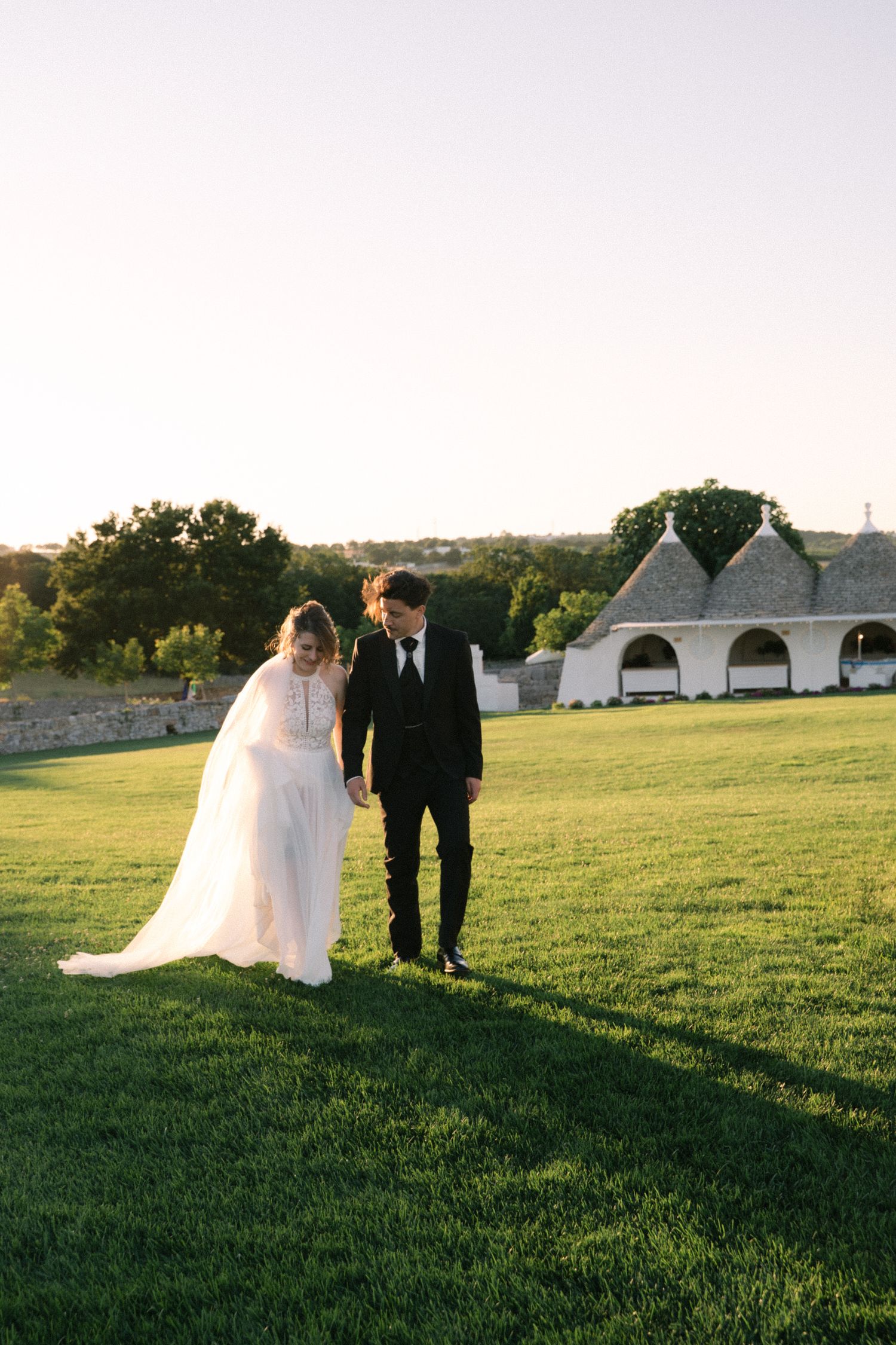 Destination wedding photography in Alberobello, Puglia, captured in digital with a clean and elegant visual style.