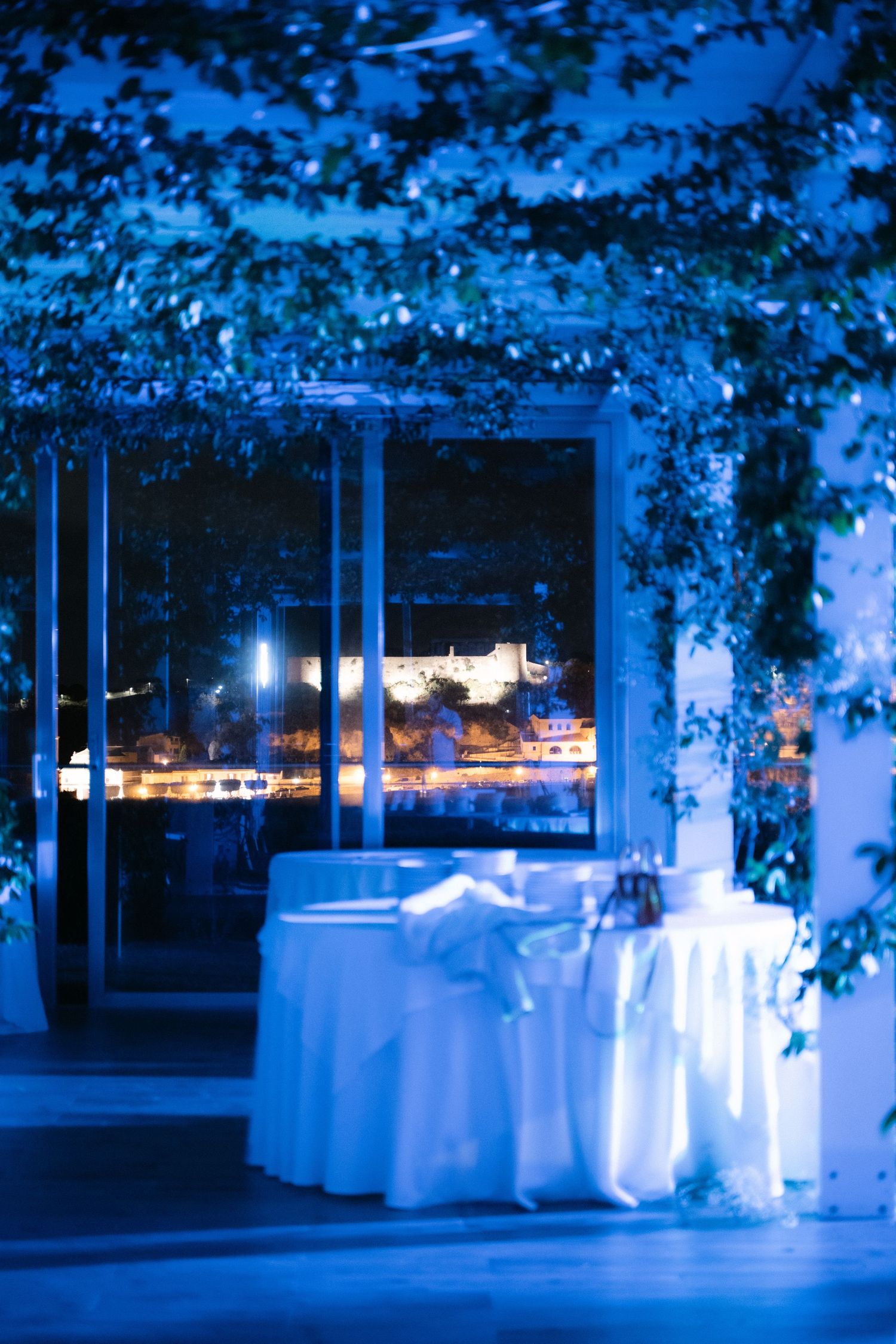 Evening wedding venue overlooking the illuminated coast of Milazzo