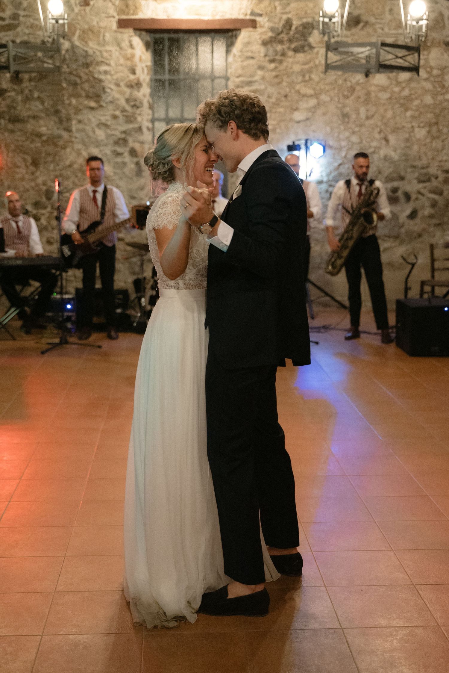 Bride and groom sharing their first dance with a live band