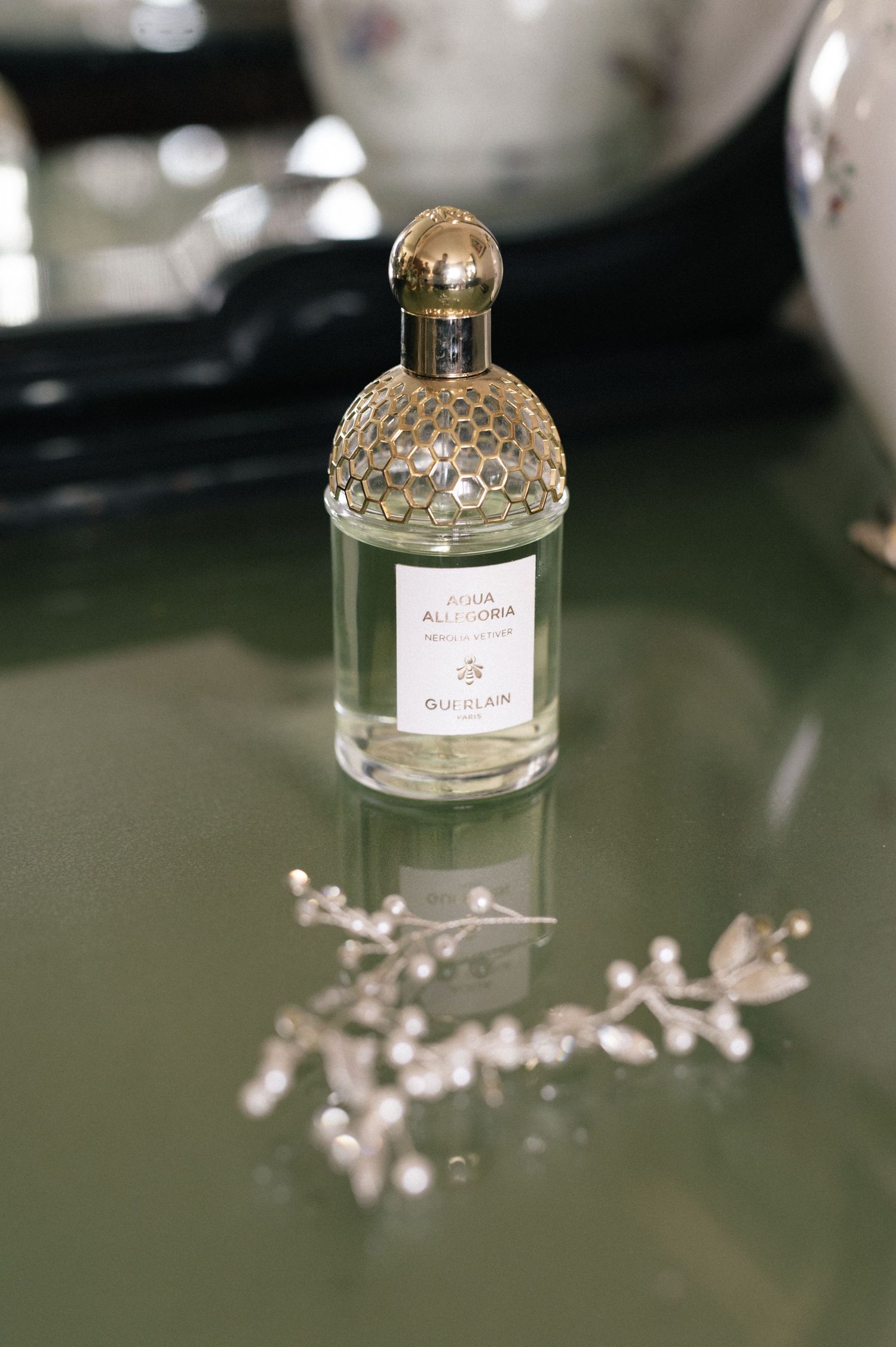 Bridal perfume and hair accessory during wedding preparations