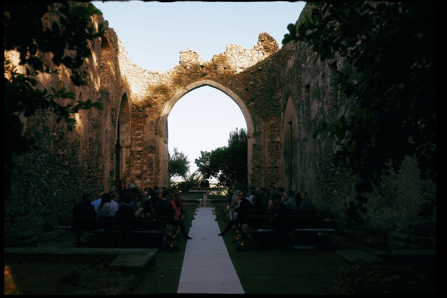 Analog photograph of the ceremony inside the historic monastery ruins