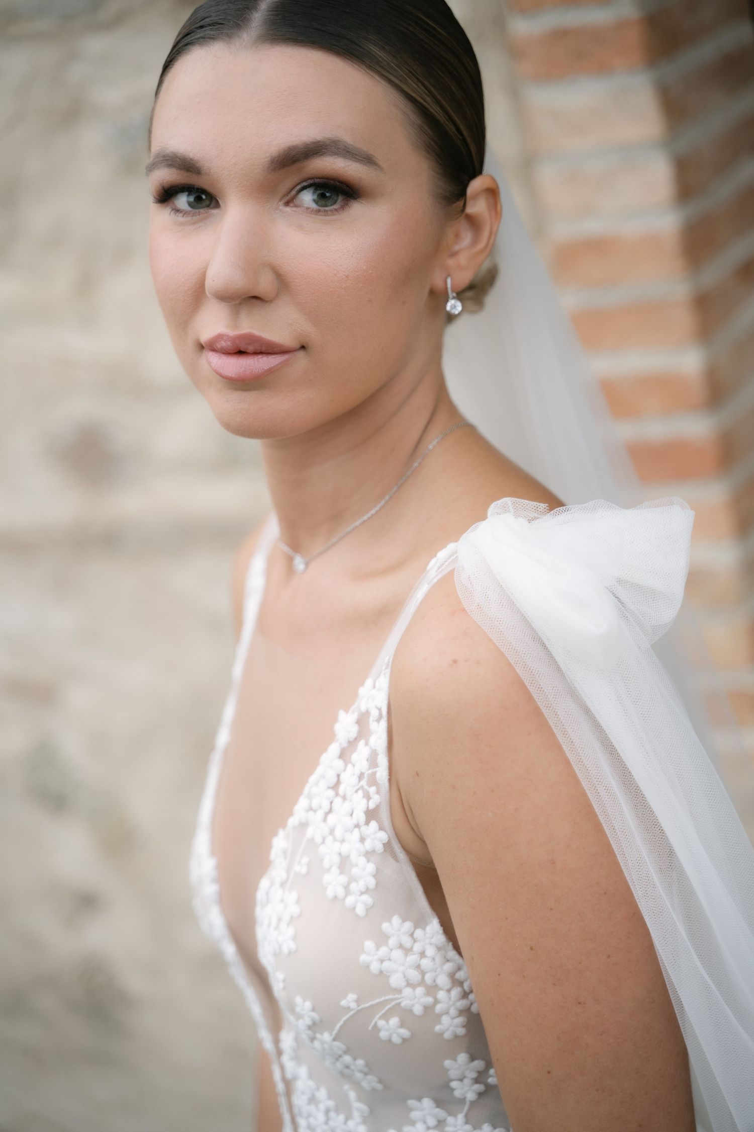 Bride wearing a floral lace wedding dress before the ceremony