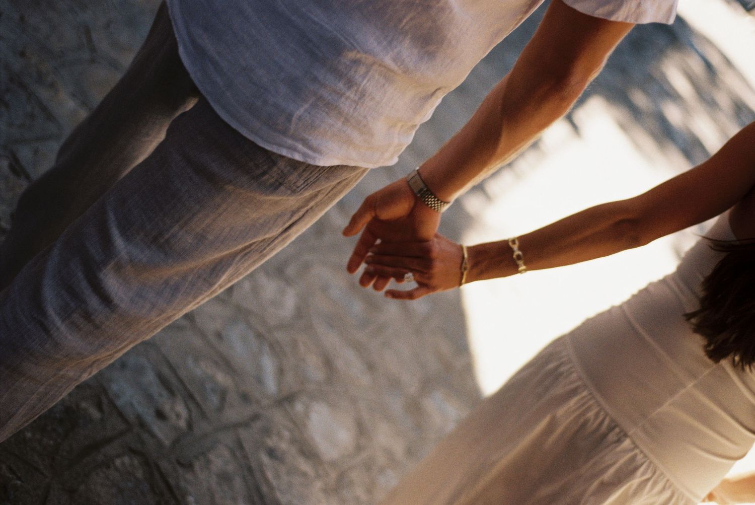 Couple walking hand in hand through Ravello photographed on 35mm film
