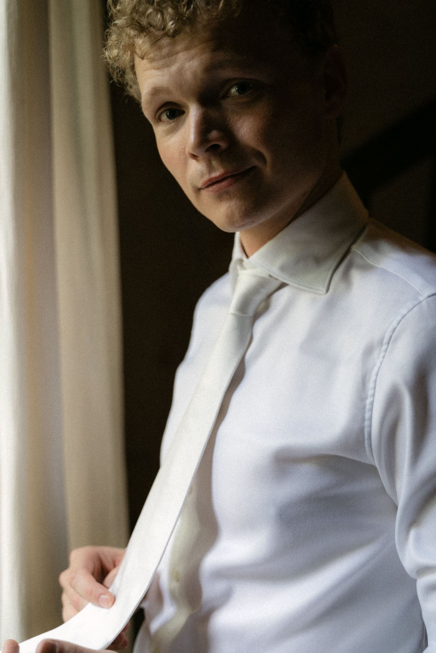 Portrait of the groom during wedding preparations in Calabria