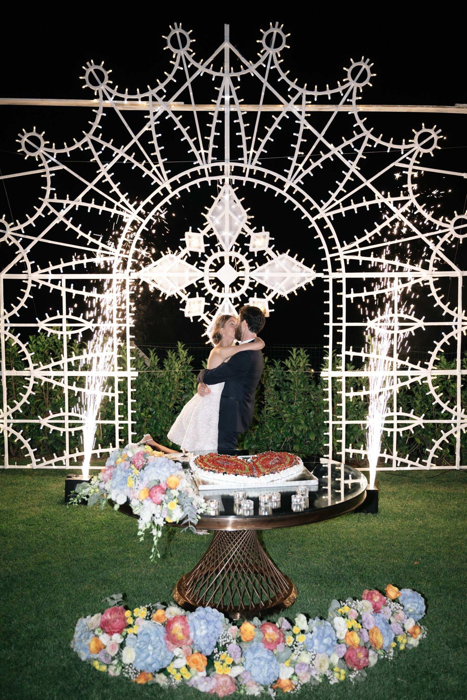 Giulia and Metz celebrating their wedding cake moment at Villa Perara