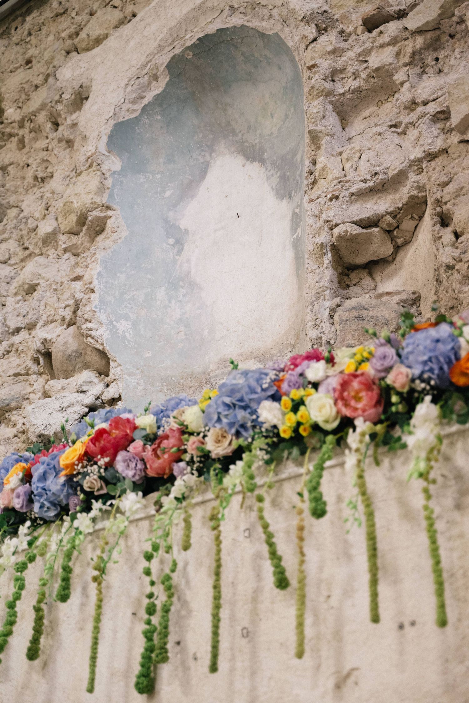 Colourful wedding flowers inside the historic ceremony venue