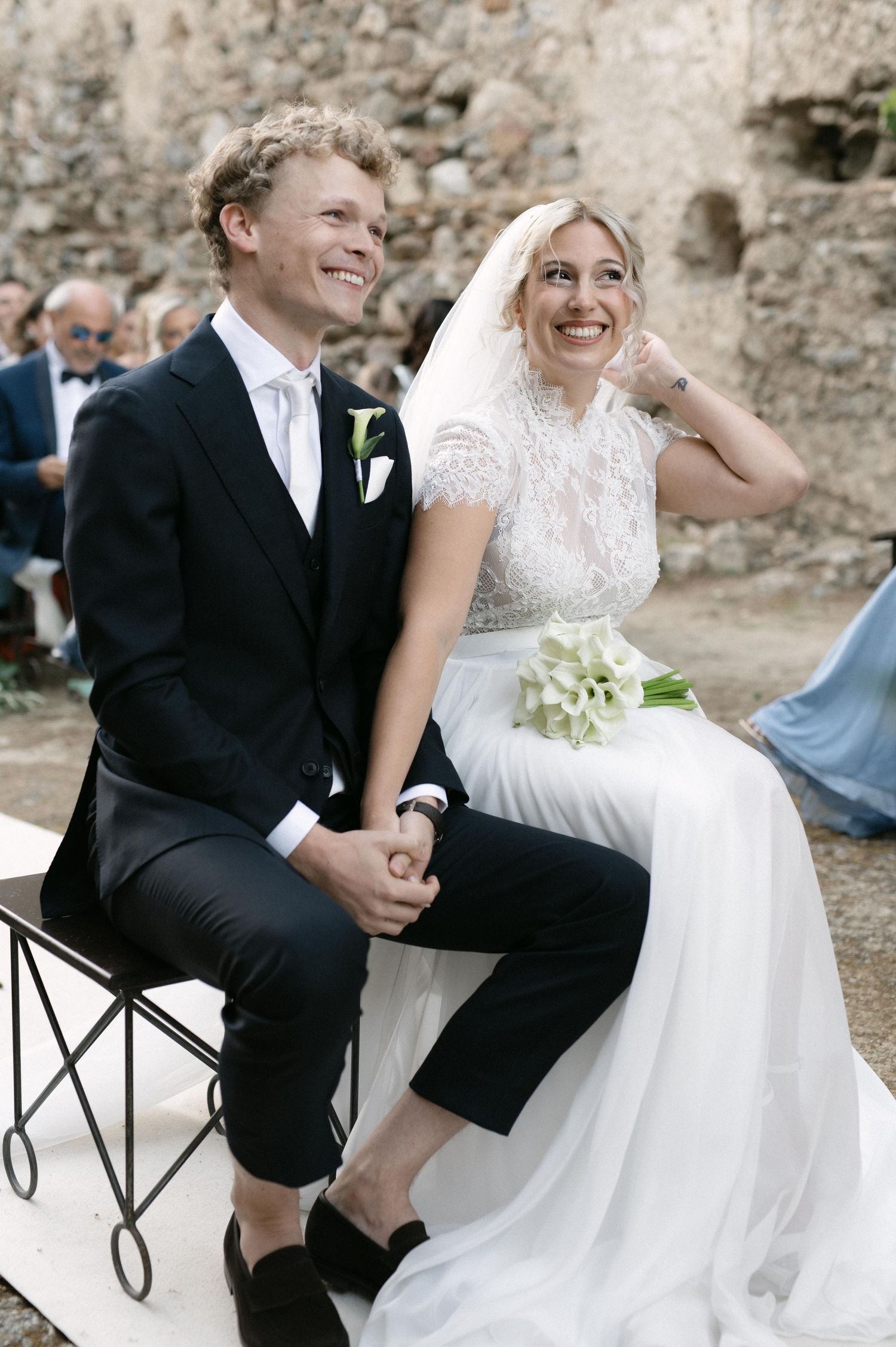Serena and Paul holding hands during their wedding ceremony
