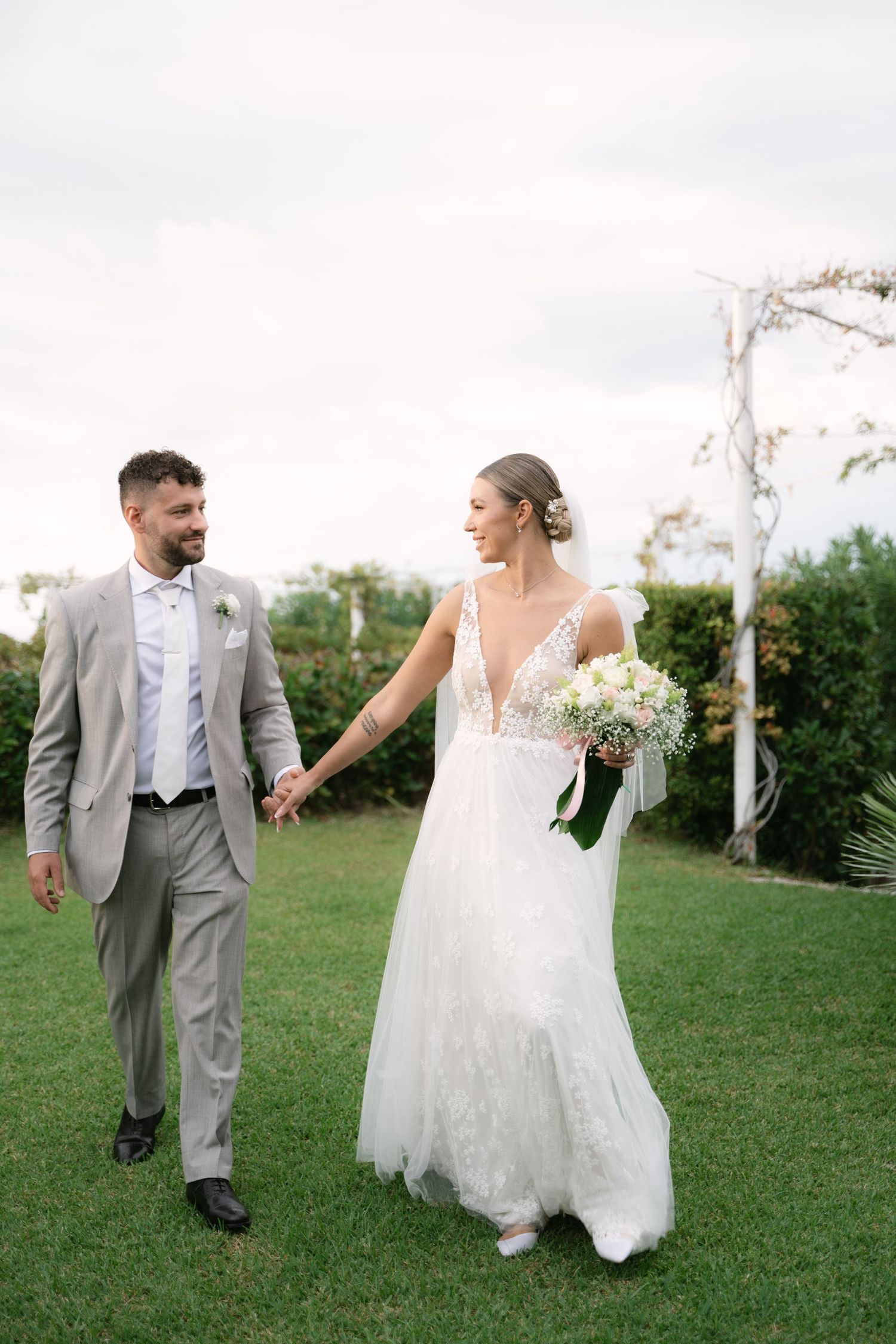 Bride and groom walking together after their wedding ceremony