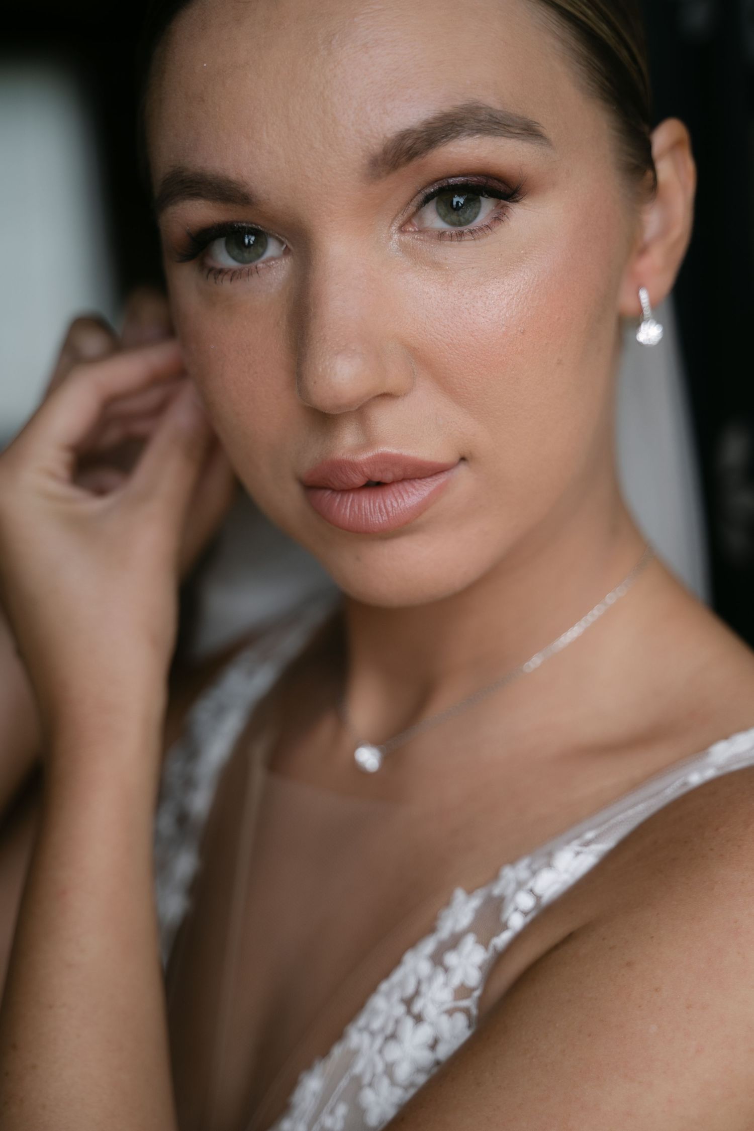 Close-up bridal portrait with wedding jewelry