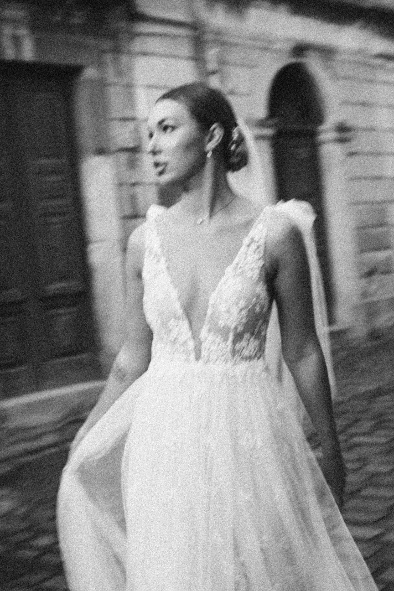 Black and white bridal portrait with intentional motion blur