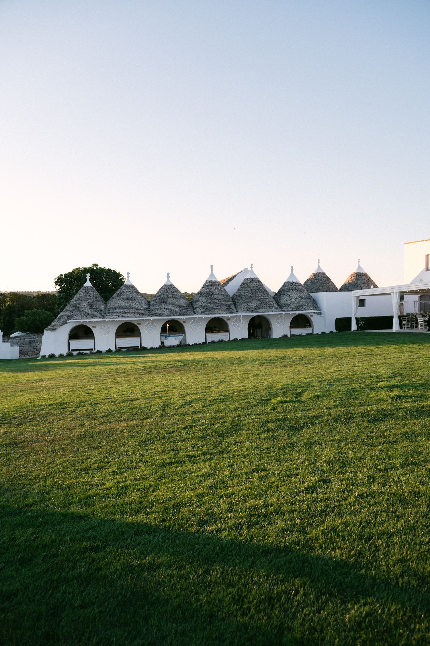 Destination wedding photography in Alberobello, Puglia, captured in digital with a clean and elegant visual style.