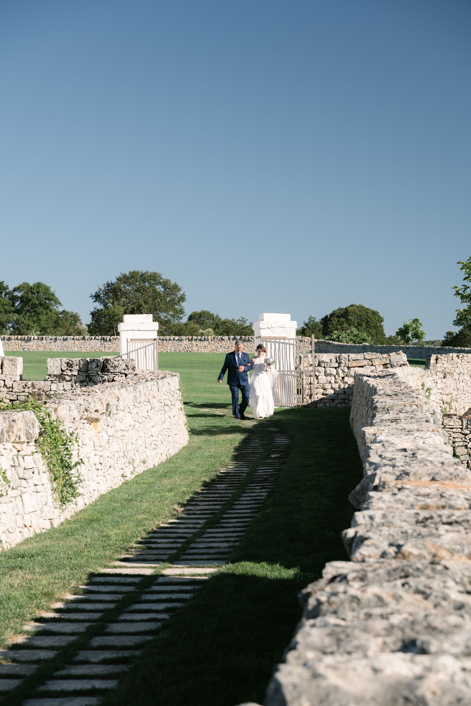 Destination wedding photography in Alberobello, Puglia, captured in digital with a clean and elegant visual style.