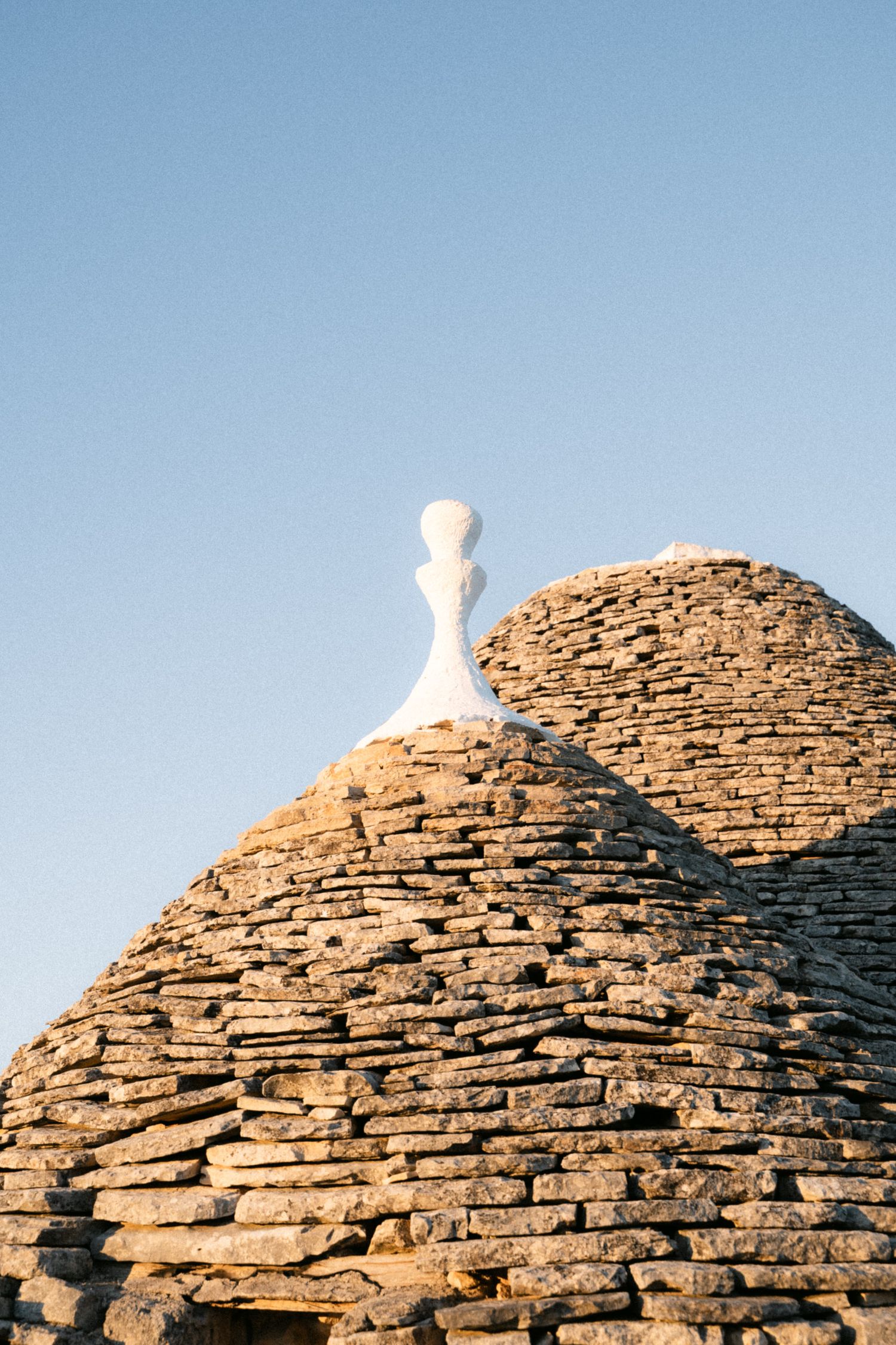 Destination wedding photography in Alberobello, Puglia, captured in digital with a clean and elegant visual style.