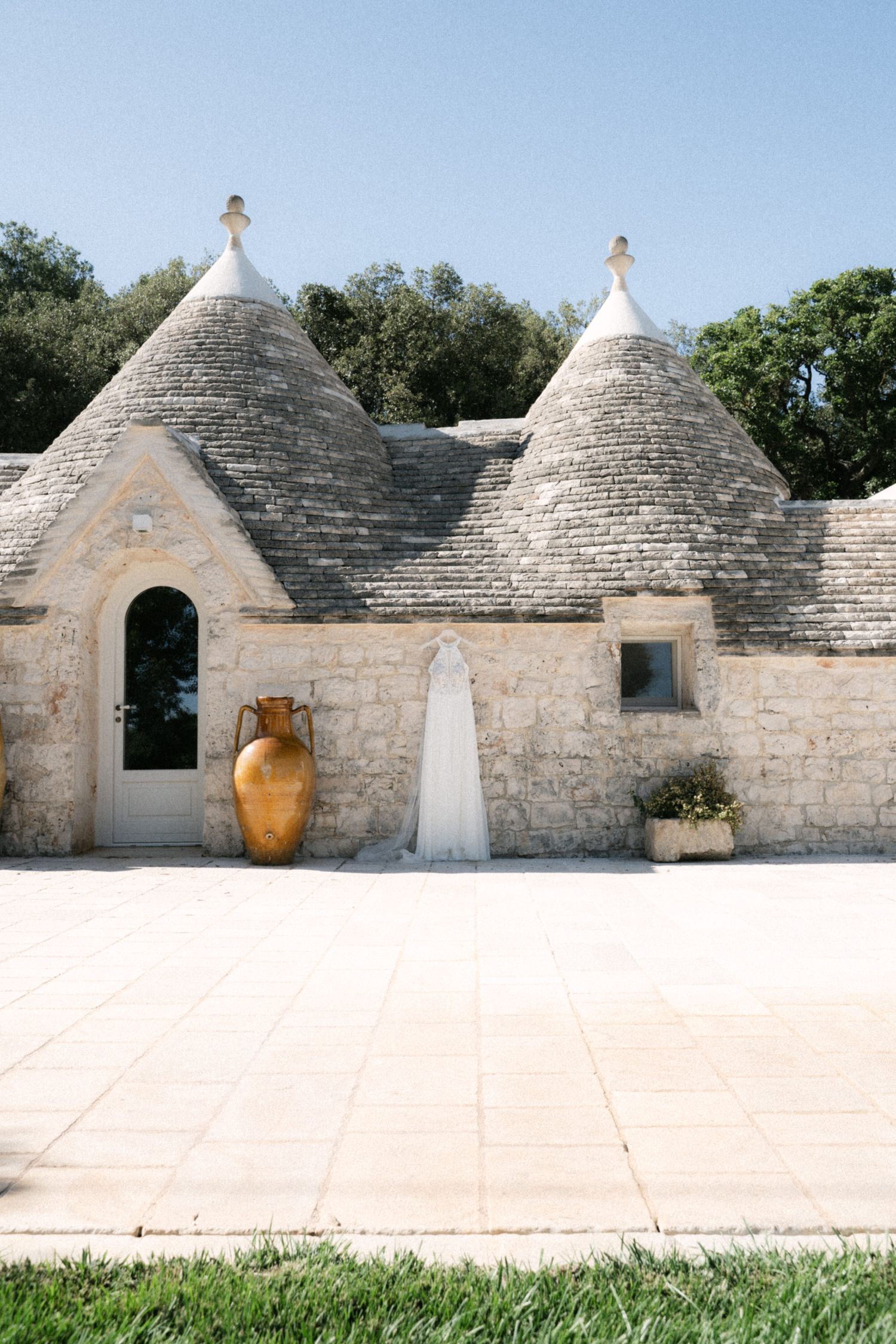 Destination wedding photography in Alberobello, Puglia, captured in digital with a clean and elegant visual style.